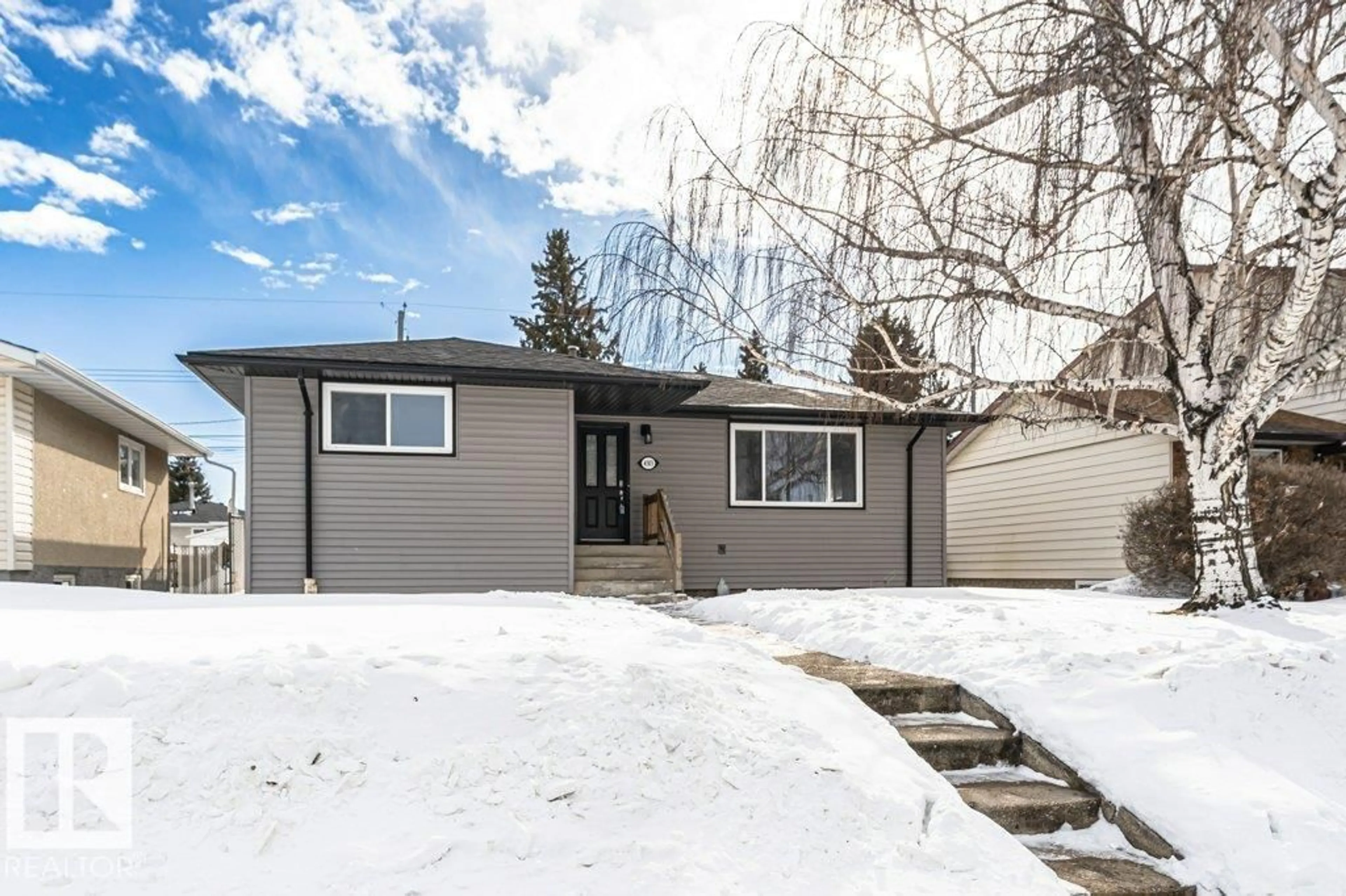 Home with vinyl exterior material, street for 4303 104A AV, Edmonton Alberta T6A0Z2