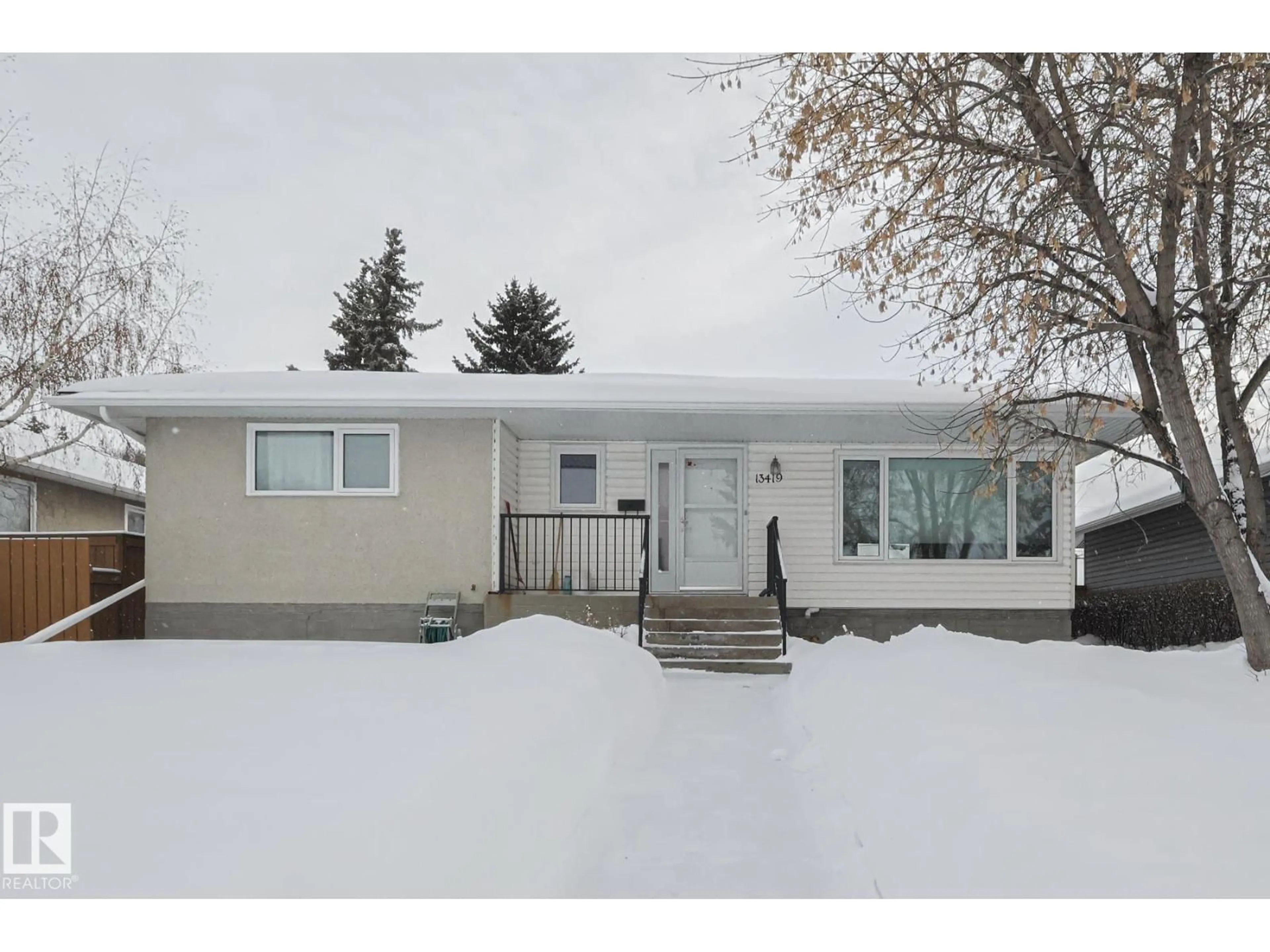 Home with vinyl exterior material, street for 13419 102 ST, Edmonton Alberta T5E4K1