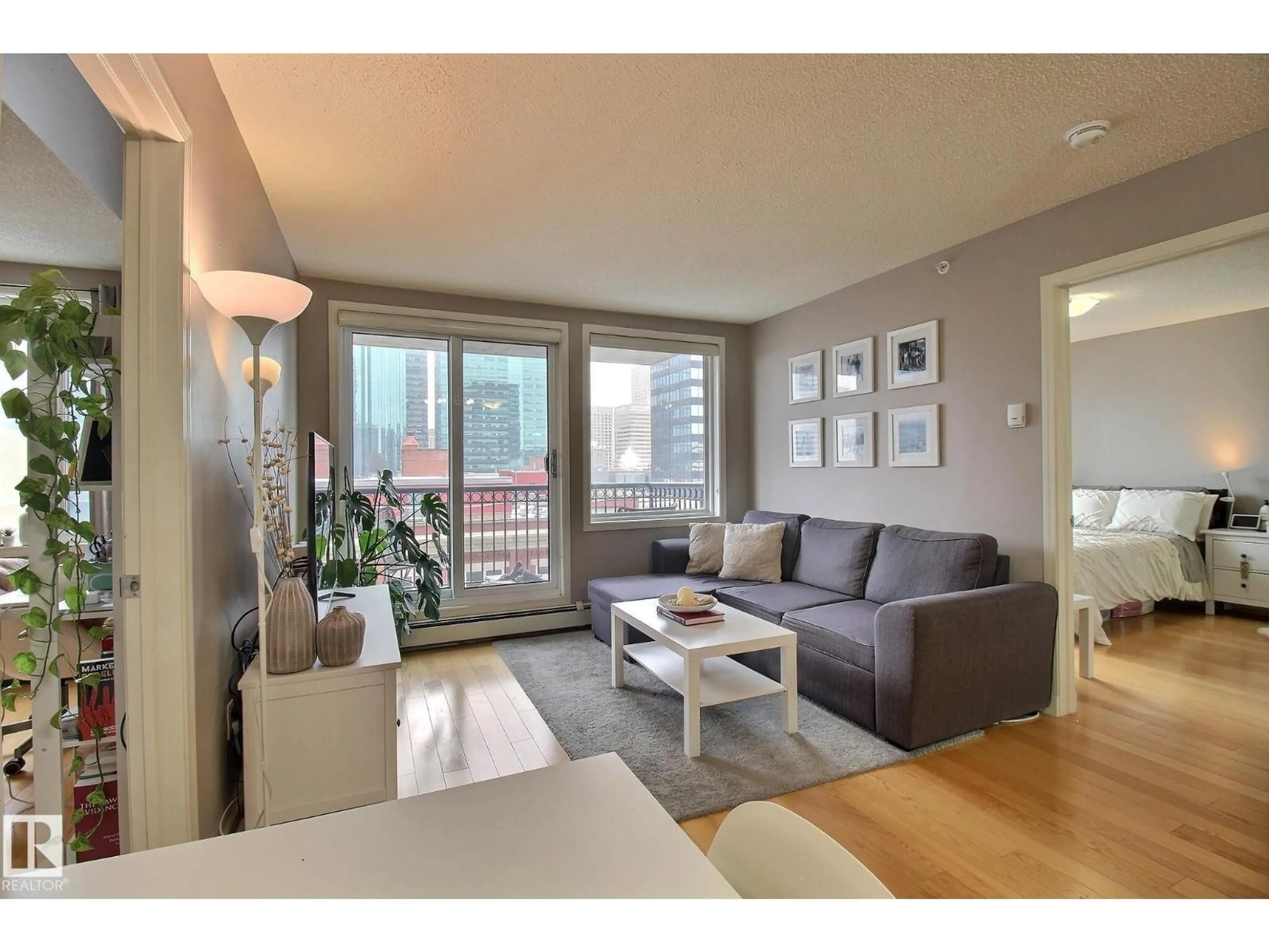 Living room with furniture, wood/laminate floor for #803 - 10180 104 ST NW, Edmonton Alberta T5J1A7