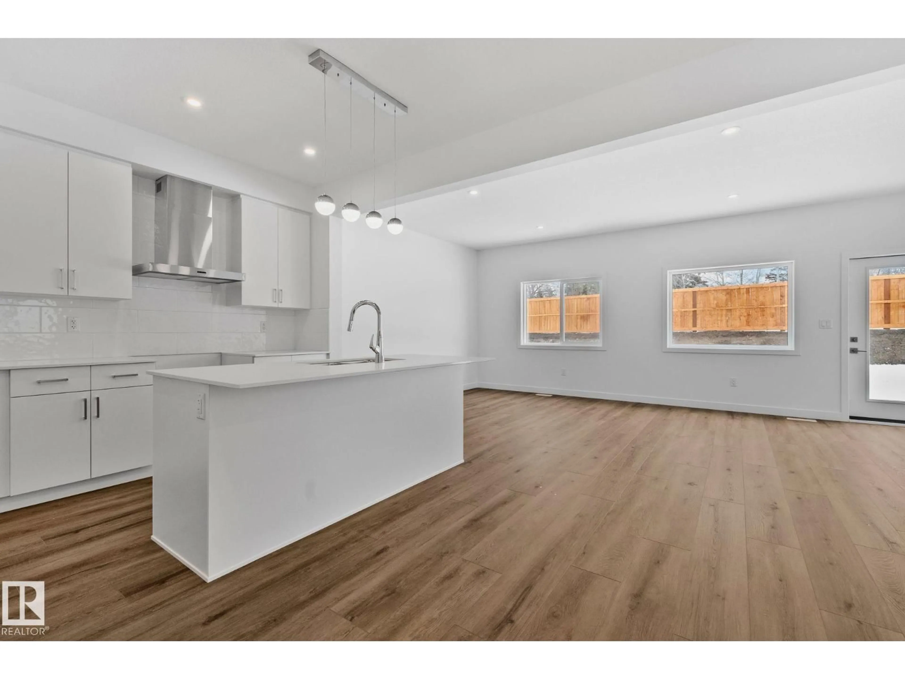 Open concept kitchen, wood/laminate floor for 128 ROYAL STREET, St. Albert Alberta T8N8C9