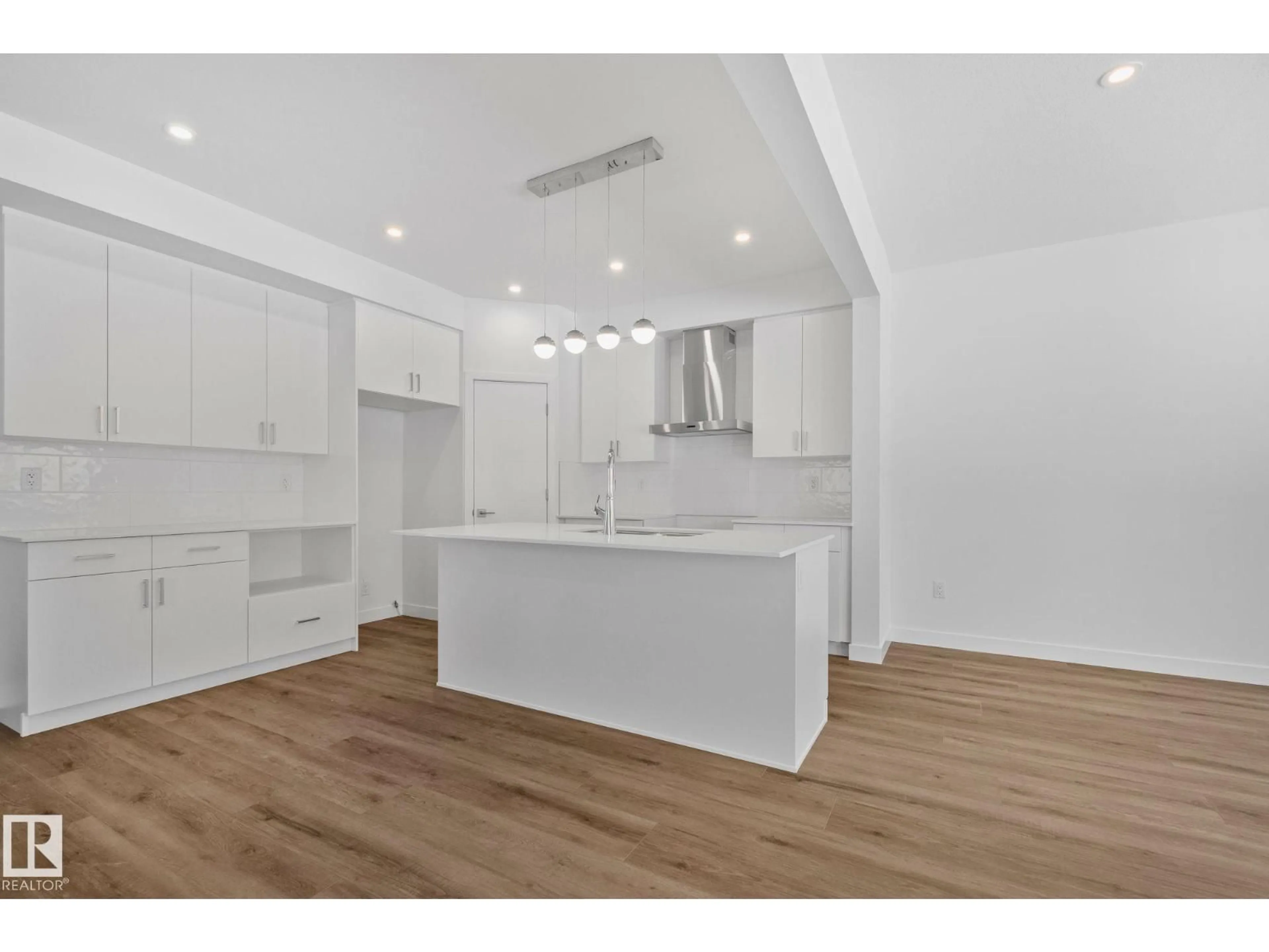 Open concept kitchen, wood/laminate floor for 128 ROYAL STREET, St. Albert Alberta T8N8C9