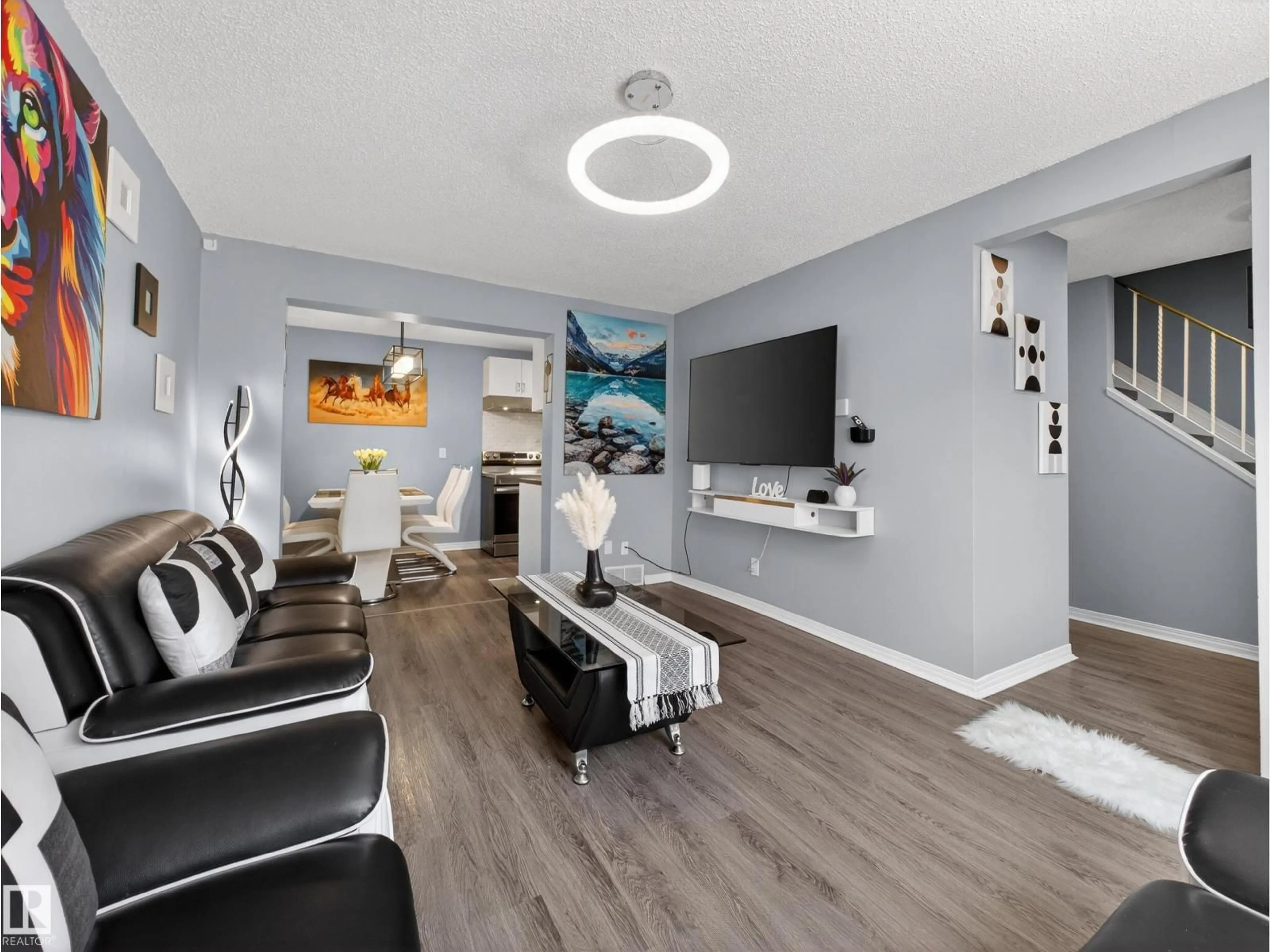 Living room with furniture, wood/laminate floor for 18F CALLINGWOOD CO, Edmonton Alberta T5T0H5