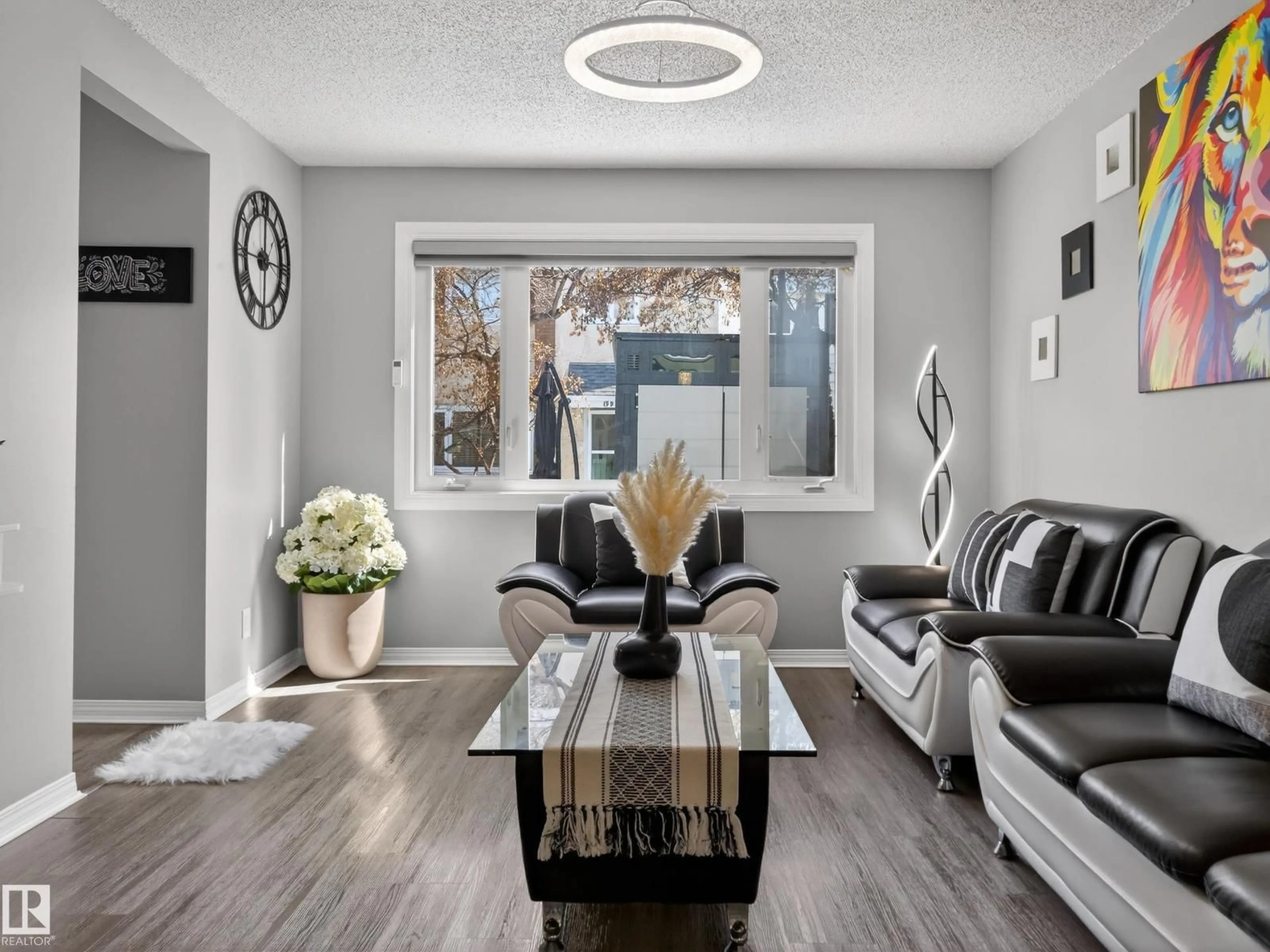 Living room with furniture, wood/laminate floor for 18F CALLINGWOOD CO, Edmonton Alberta T5T0H5