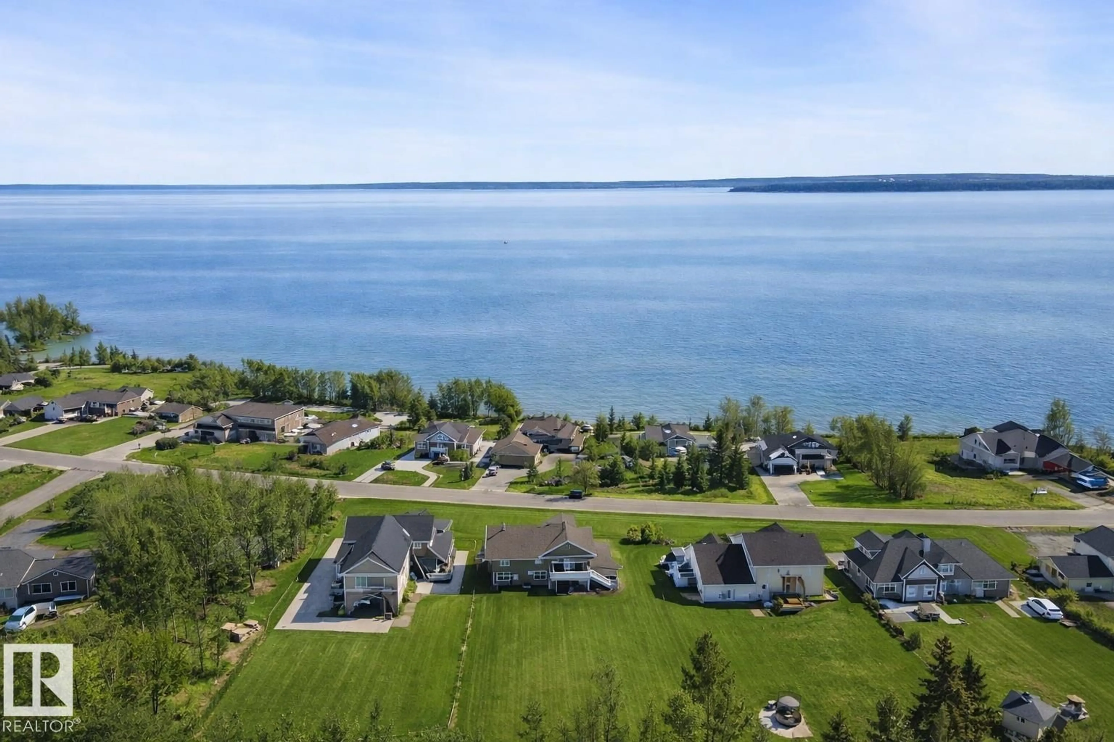 A pic from outside/outdoor area/front of a property/back of a property/a pic from drone, water/lake/river/ocean view for 1513 HORSESHOE BAY ES, Cold Lake Alberta T9M1G8