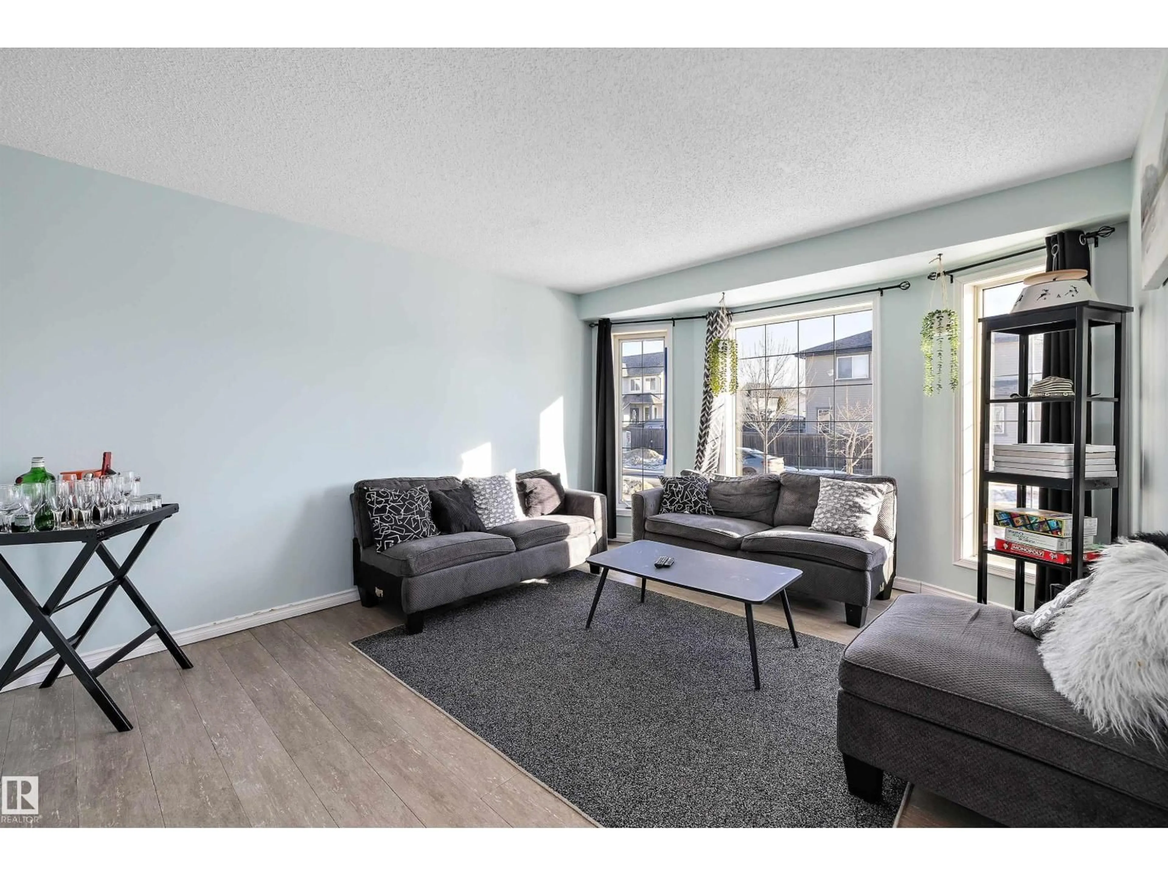 Living room with furniture, wood/laminate floor for 16304 43 ST, Edmonton Alberta T5Y0H8
