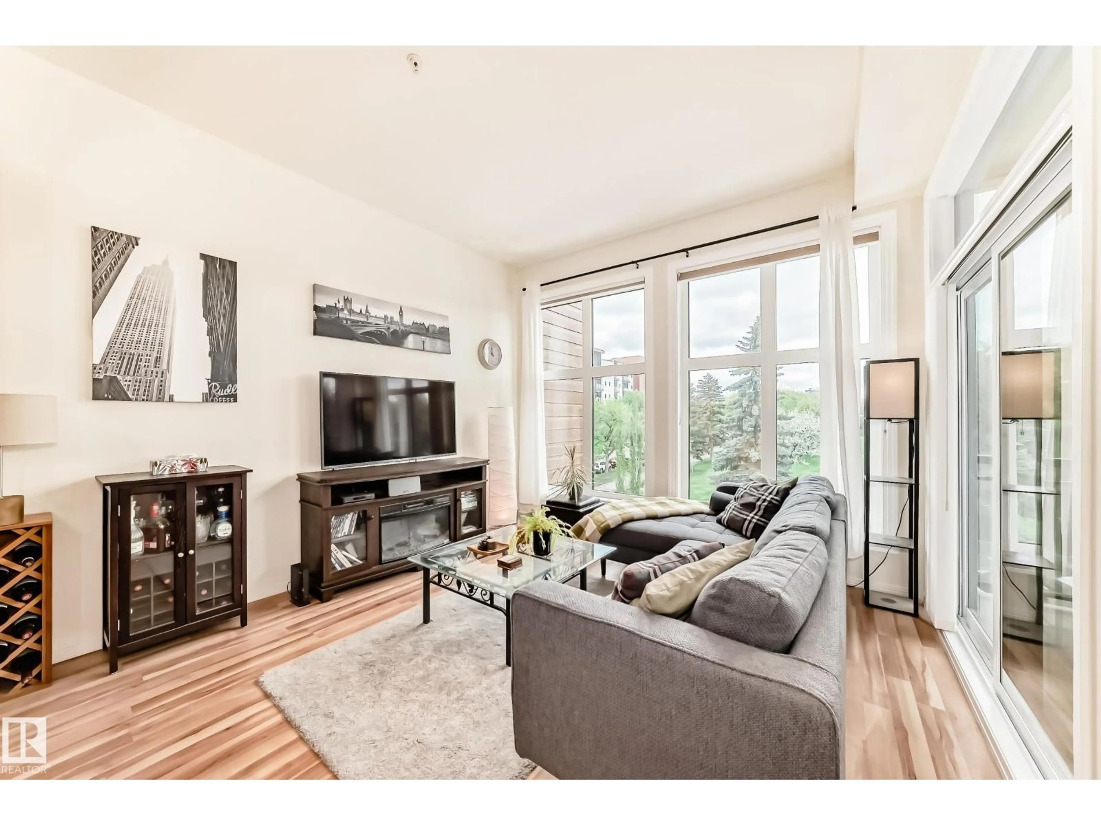 Living room with furniture, wood/laminate floor for #303 - 10531 117 ST, Edmonton Alberta T5H0A8
