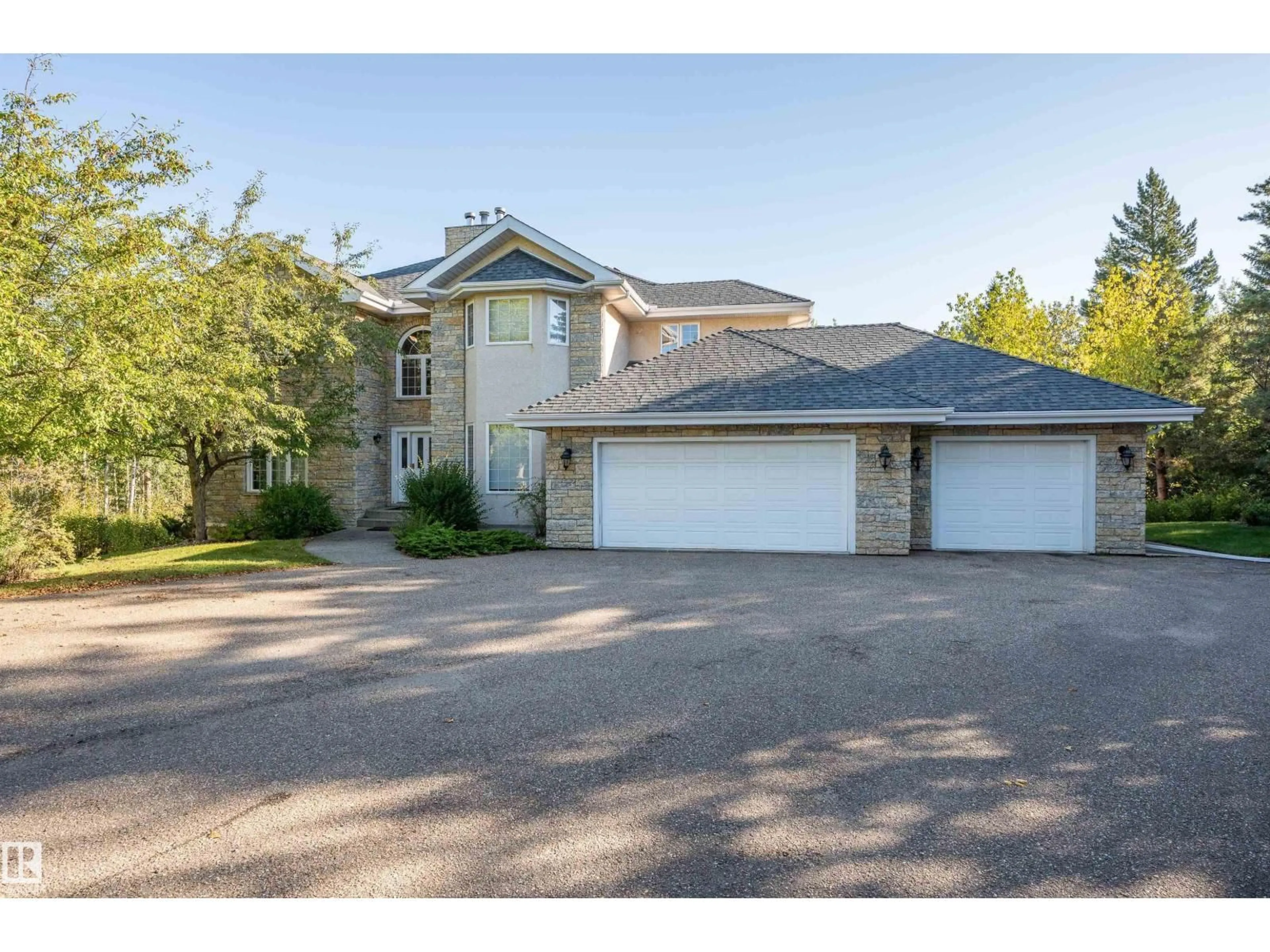 A pic from outside/outdoor area/front of a property/back of a property/a pic from drone, street for 25 - 52258 RGE ROAD 231, Rural Strathcona County Alberta T8B1M8