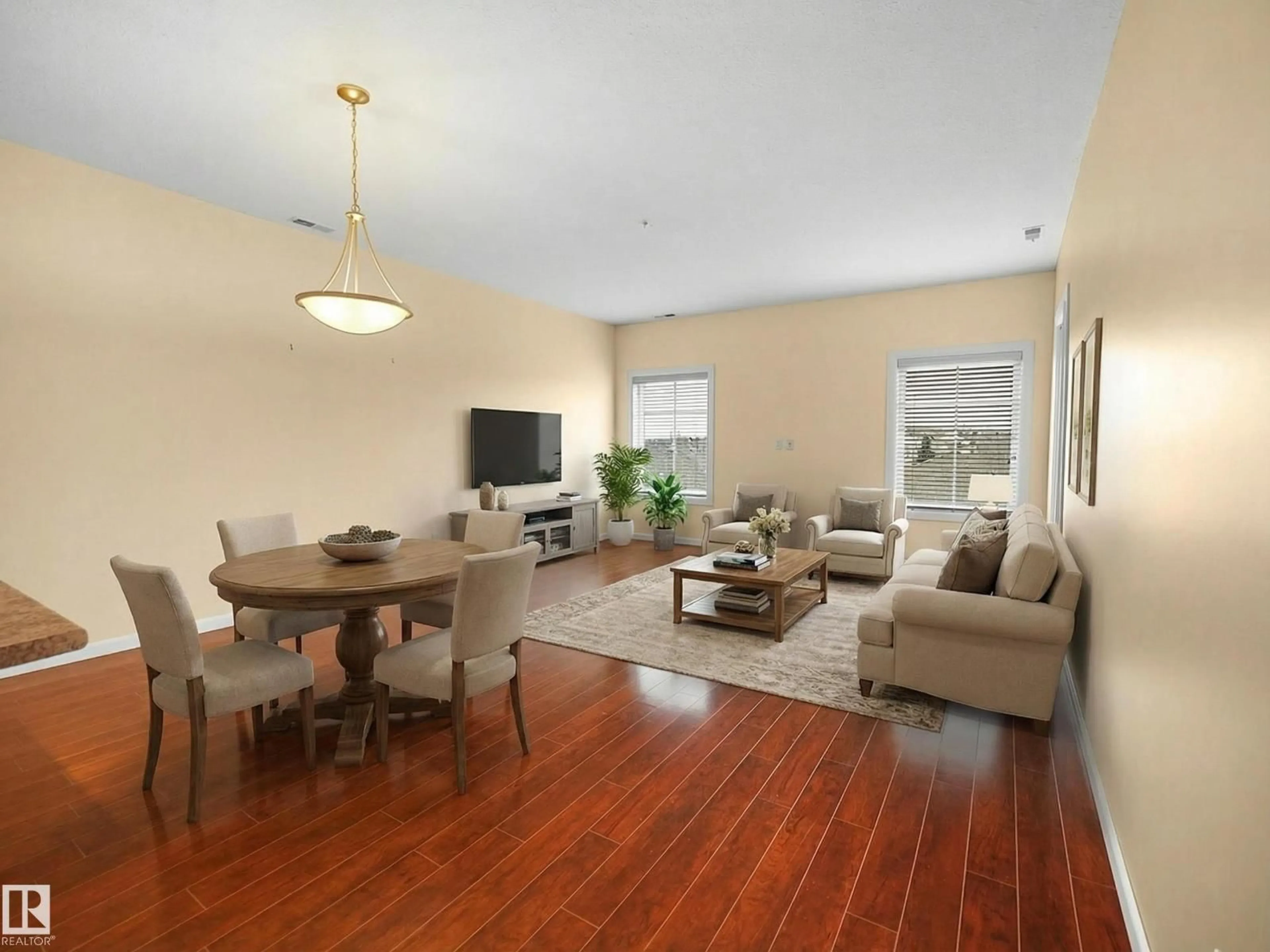 Living room with furniture, wood/laminate floor for 160 - 421 MAGRATH RD, Edmonton Alberta T6R3T7