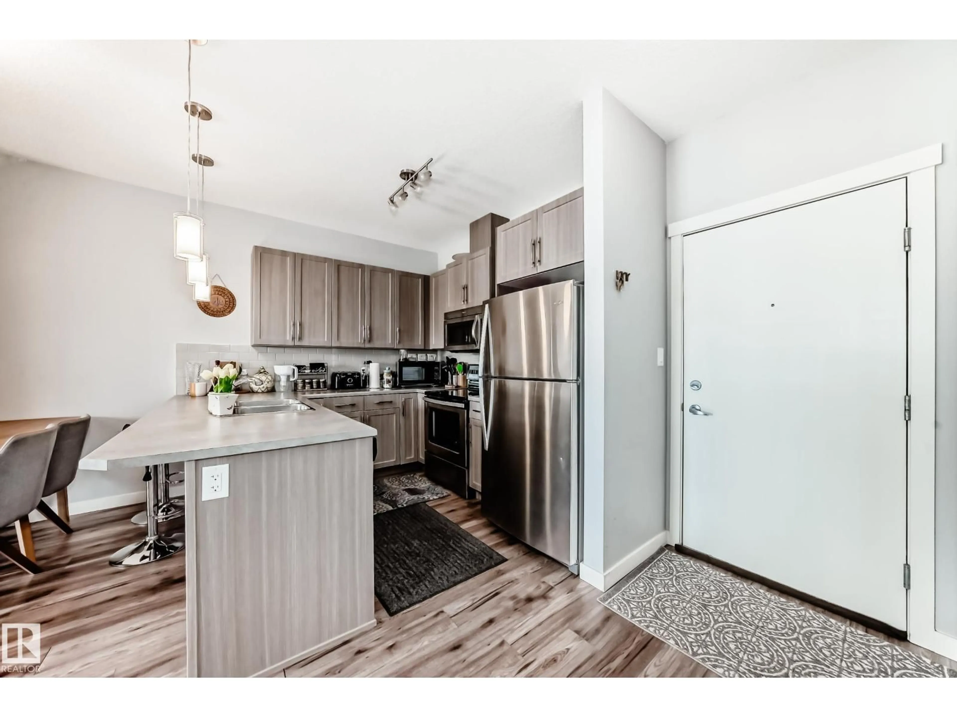 Open concept kitchen, wood/laminate floor for #208 - 812 WELSH DR, Edmonton Alberta T6X1Y7