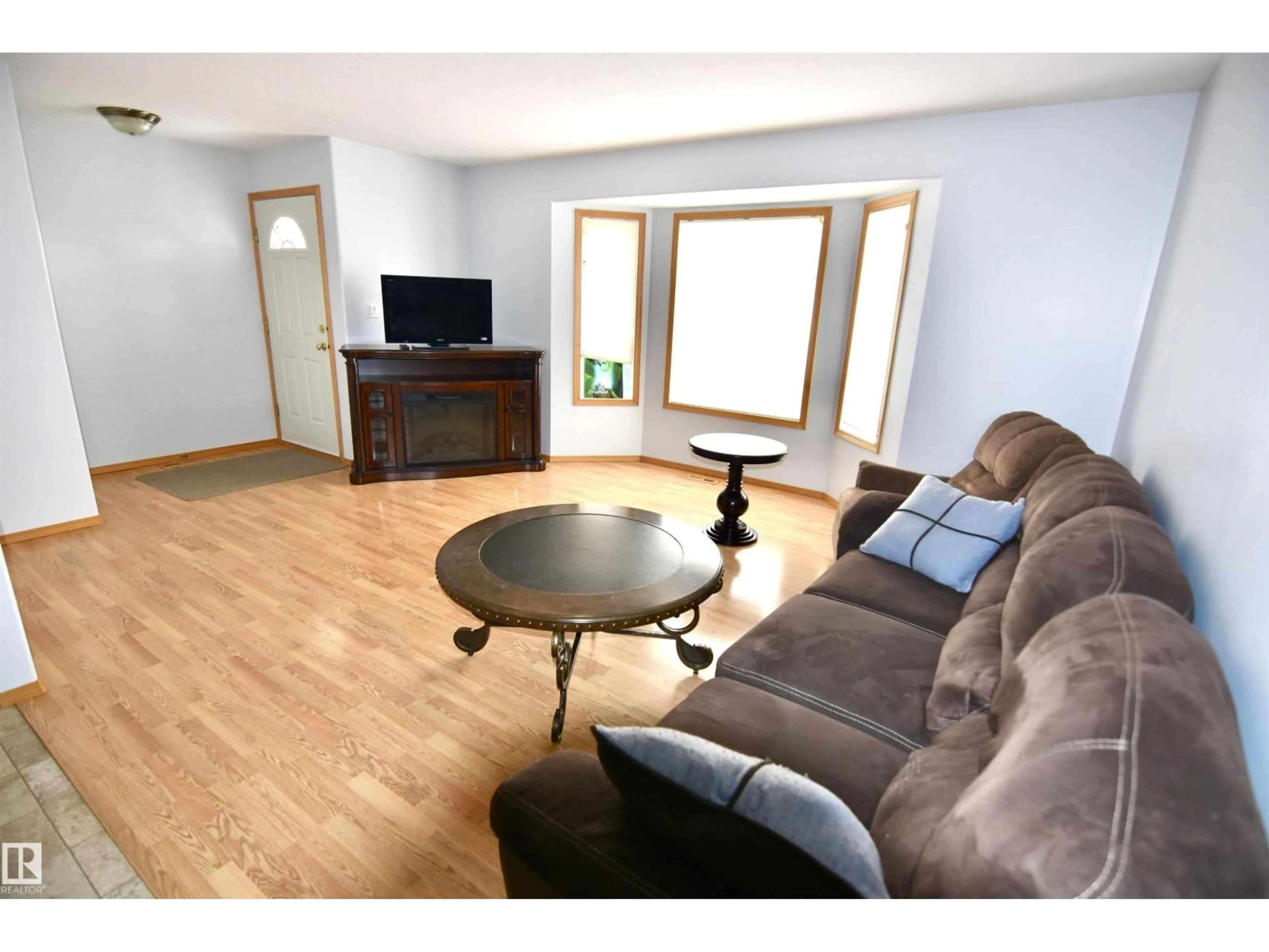 Living room with furniture, wood/laminate floor for 4820 49 AV, St. Paul Town Alberta T0A3A3