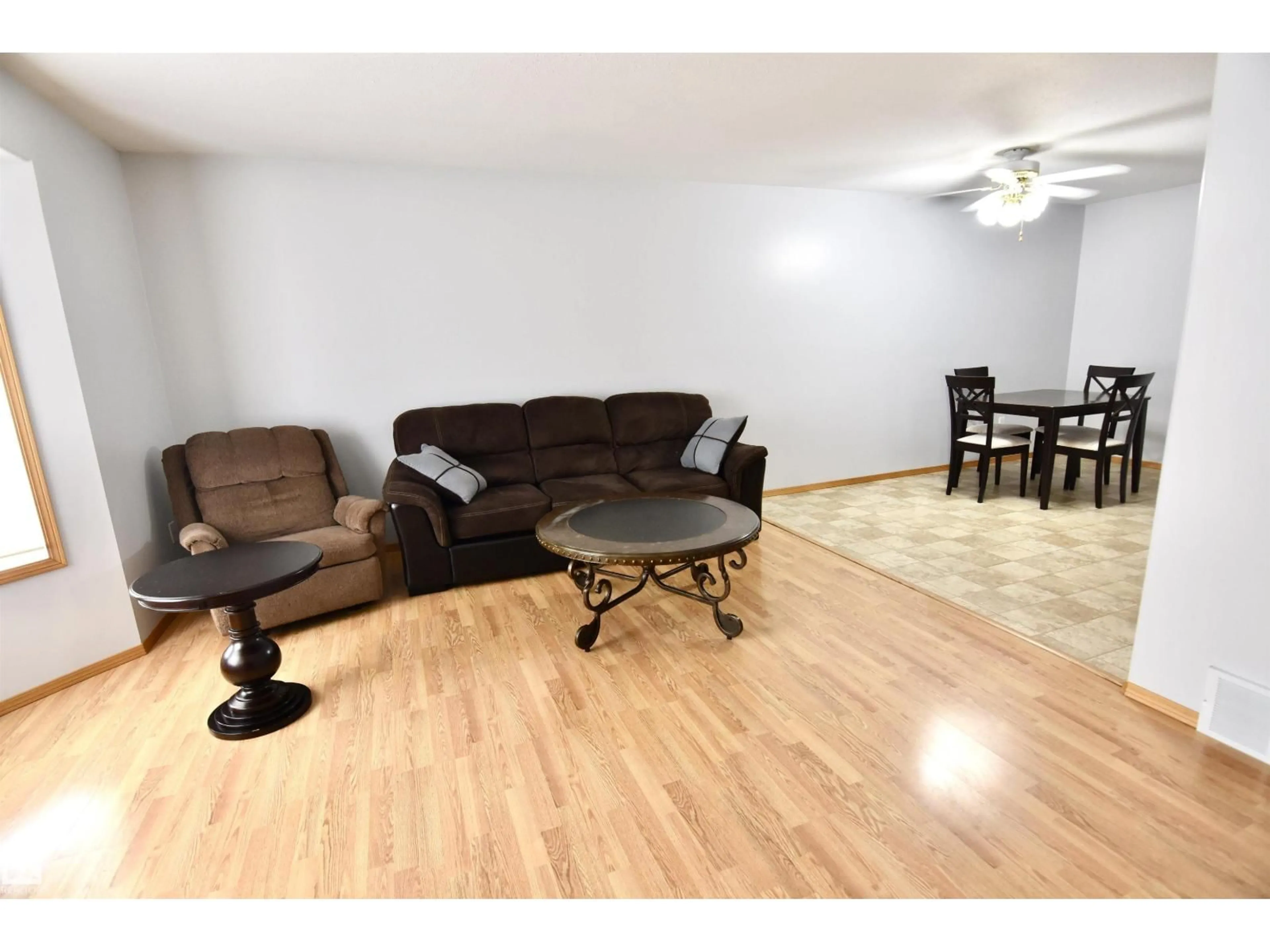 Living room with furniture, wood/laminate floor for 4820 49 AV, St. Paul Town Alberta T0A3A3