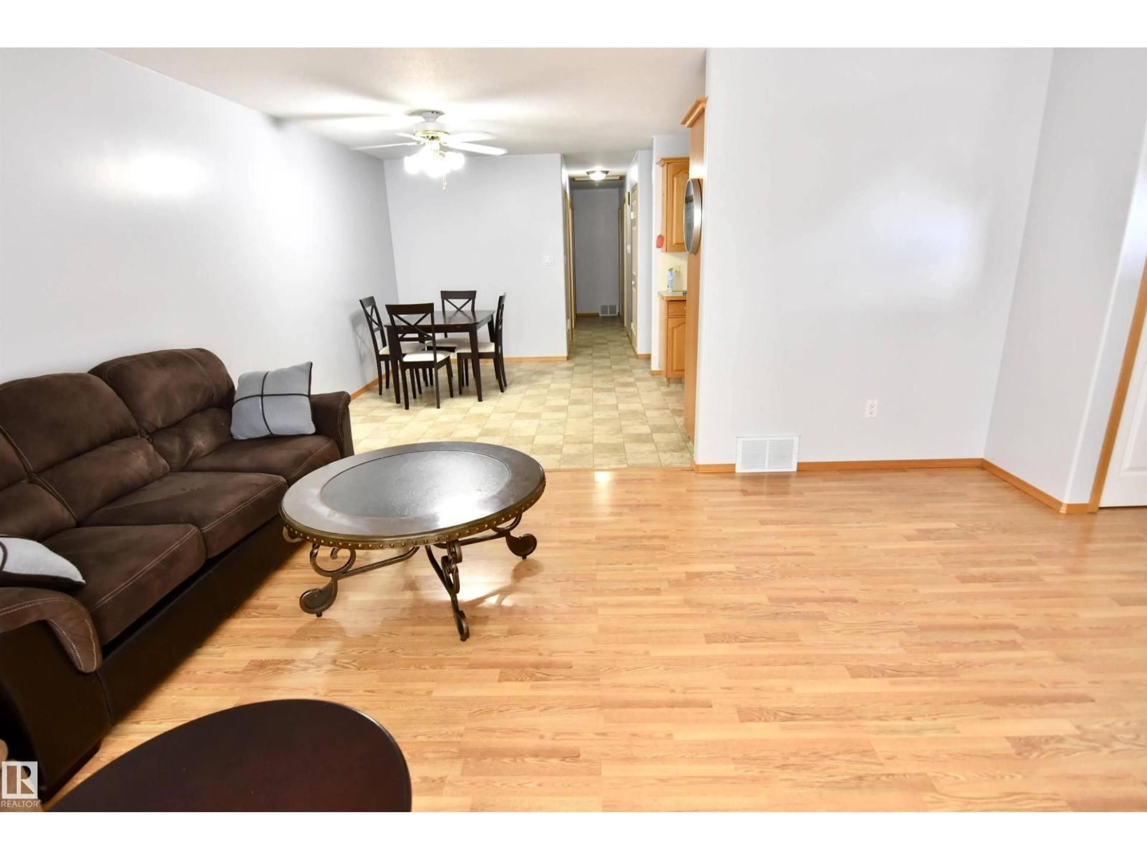 Living room with furniture, wood/laminate floor for 4820 49 AV, St. Paul Town Alberta T0A3A3