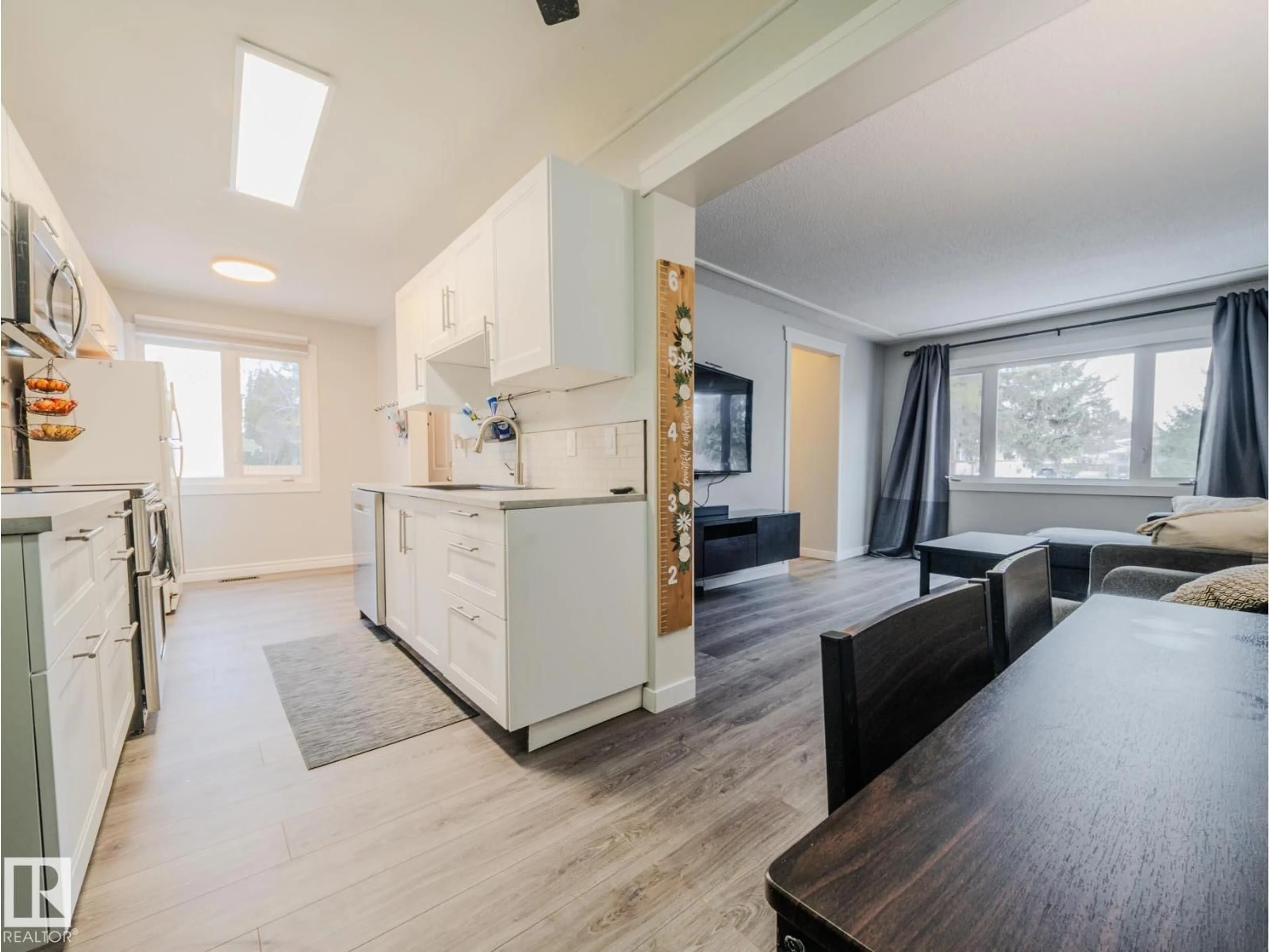 Open concept kitchen, wood/laminate floor for 21F CALLINGWOOD CT, Edmonton Alberta T5T0H5