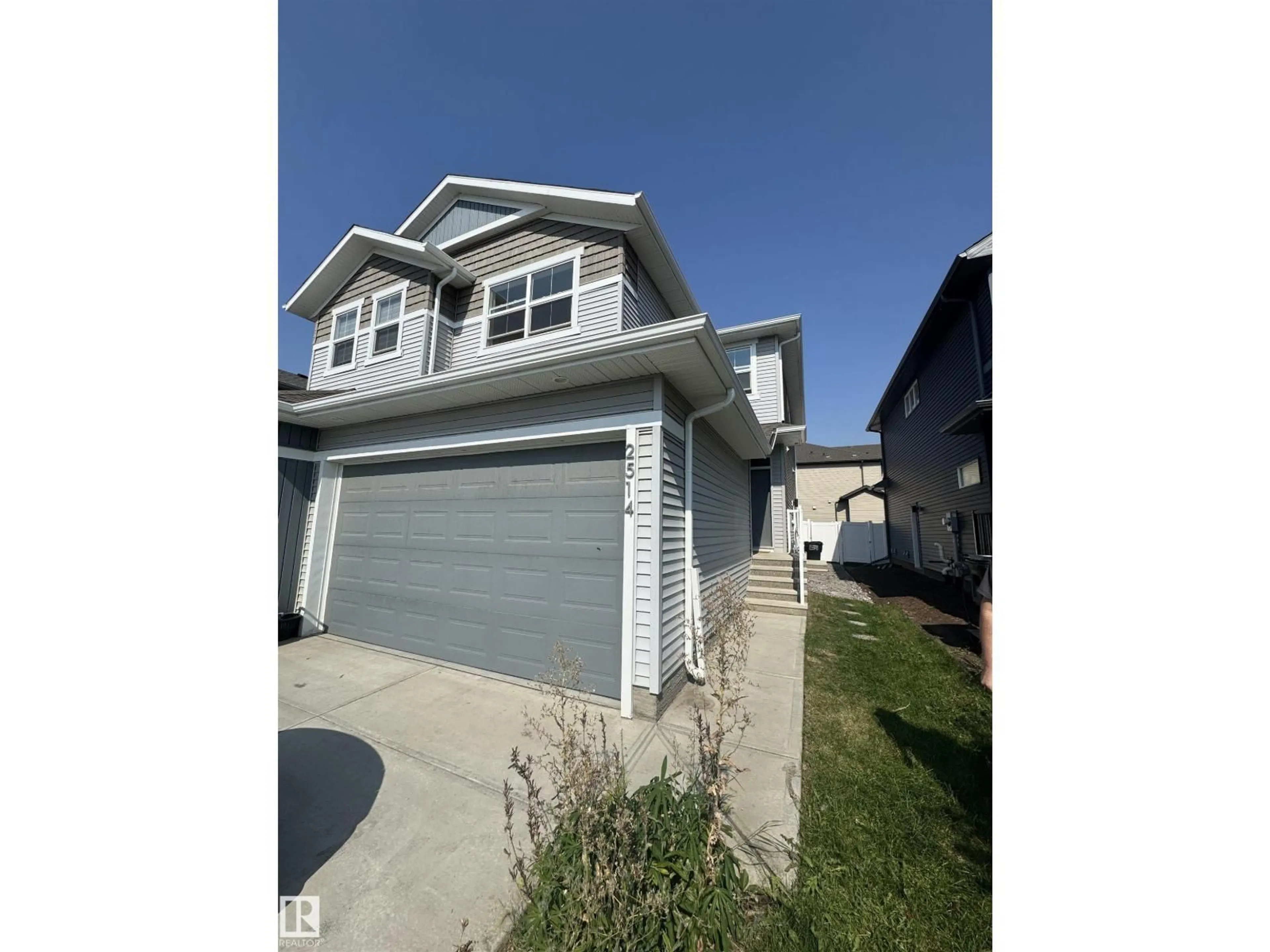 Home with vinyl exterior material, street for 2514/2518 151A AV, Edmonton Alberta T5Y3Z2