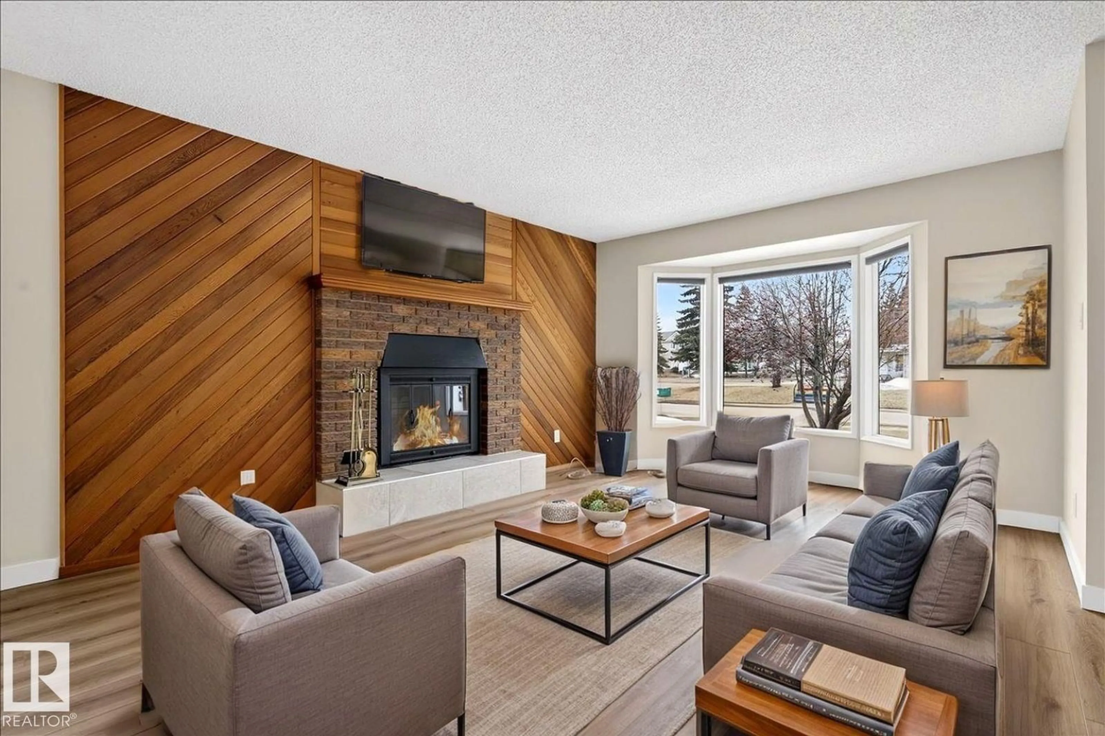 Living room with furniture, wood/laminate floor for 12 GRAND MEADOW CR, Edmonton Alberta T6L1A2