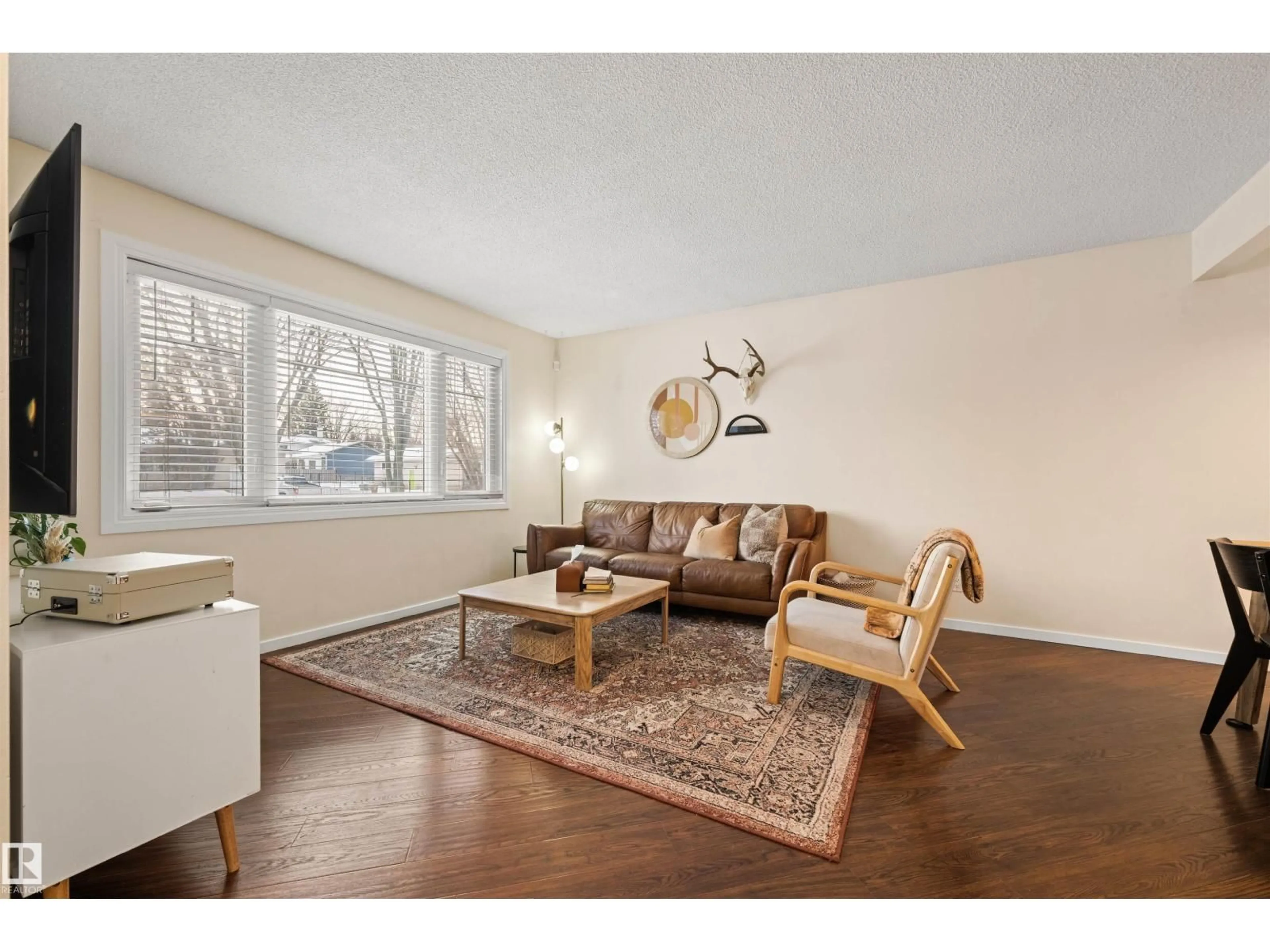 Living room with furniture, wood/laminate floor for 3 SORREL CR, St. Albert Alberta T8N0K4