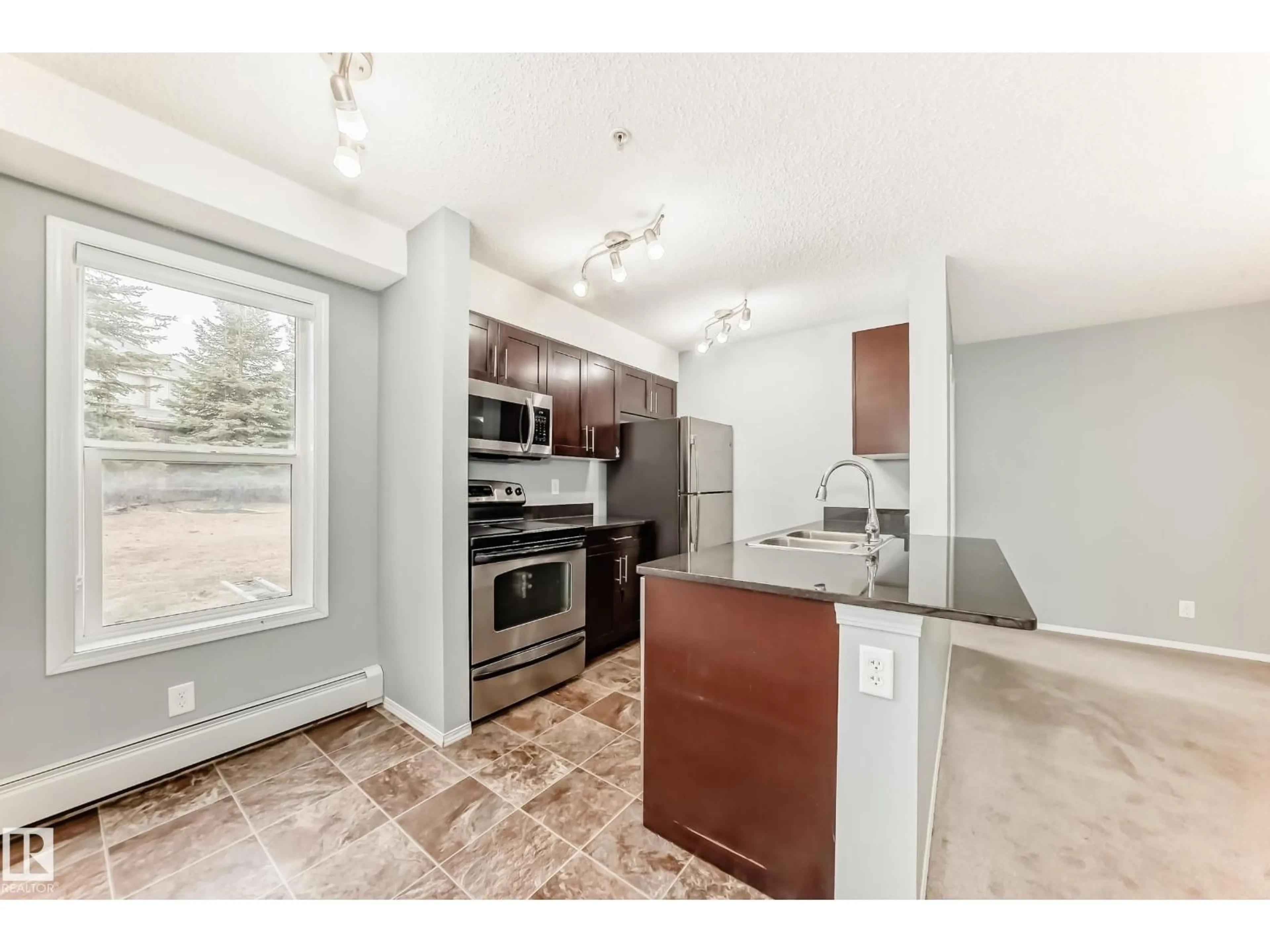 Open concept kitchen, unknown for #101 - 530 WATT BV, Edmonton Alberta T6X1P7