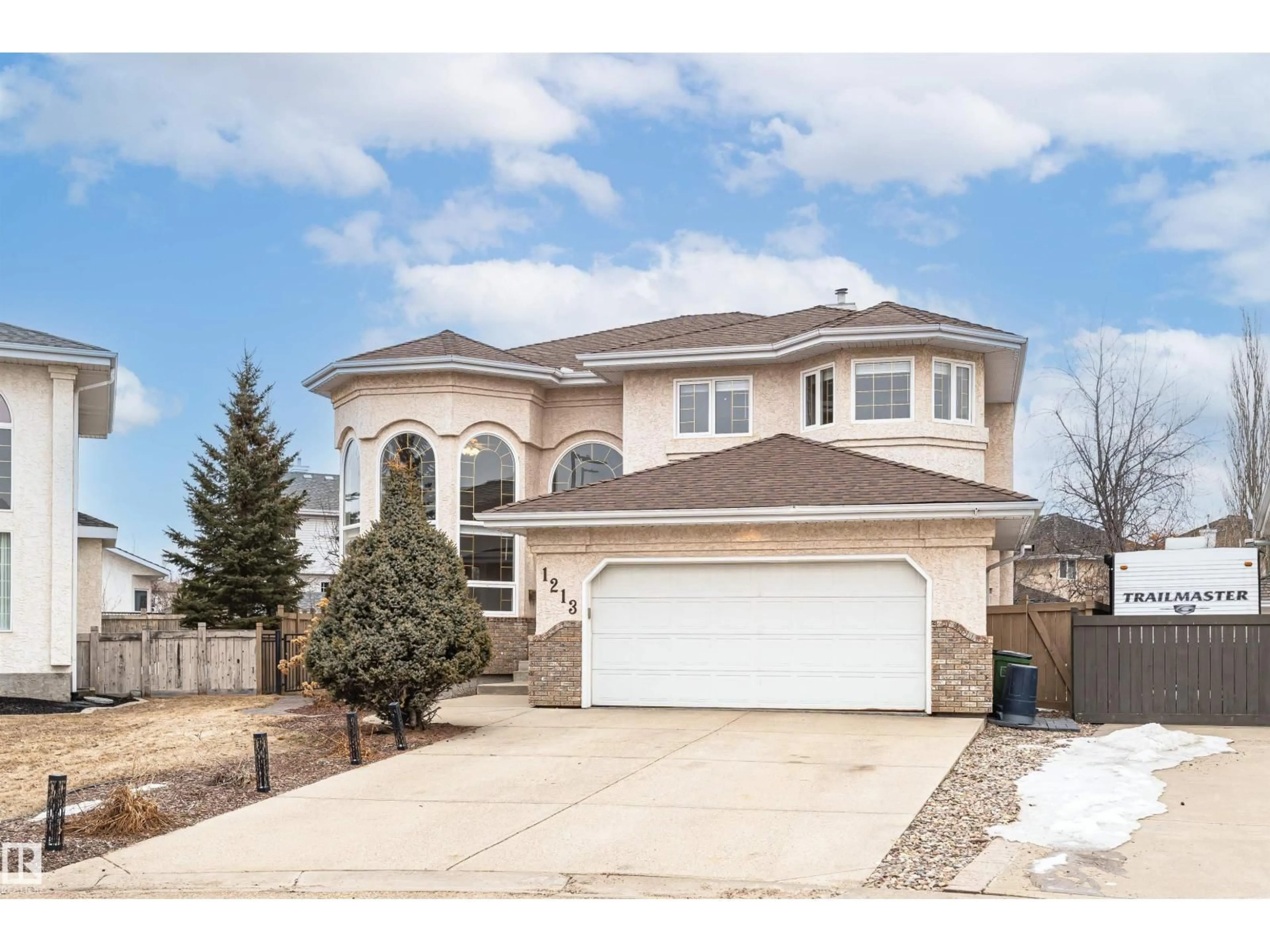 Home with vinyl exterior material, street for NW - 1213 115A ST, Edmonton Alberta T6J6Z3