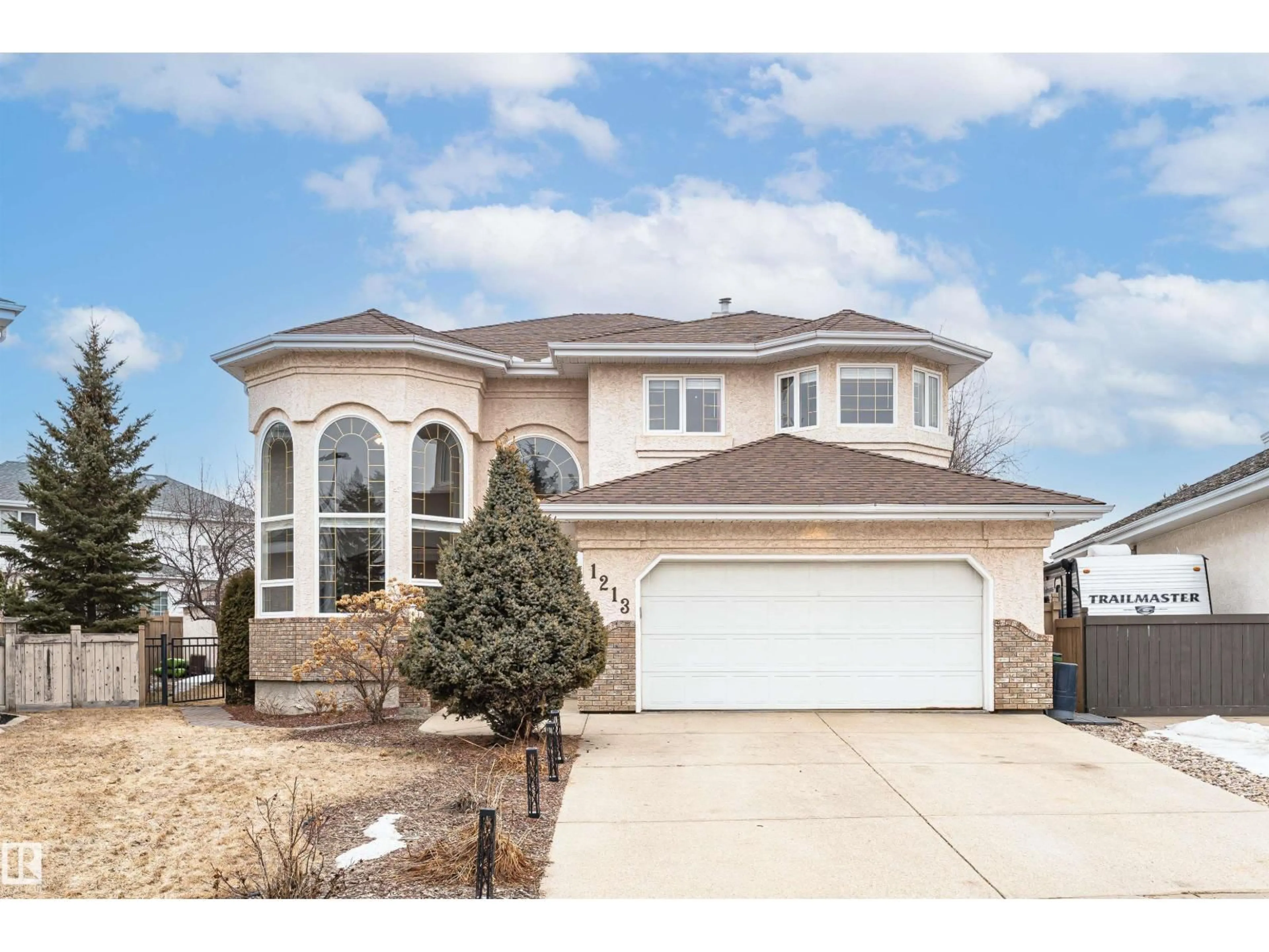 Home with vinyl exterior material, street for NW - 1213 115A ST, Edmonton Alberta T6J6Z3