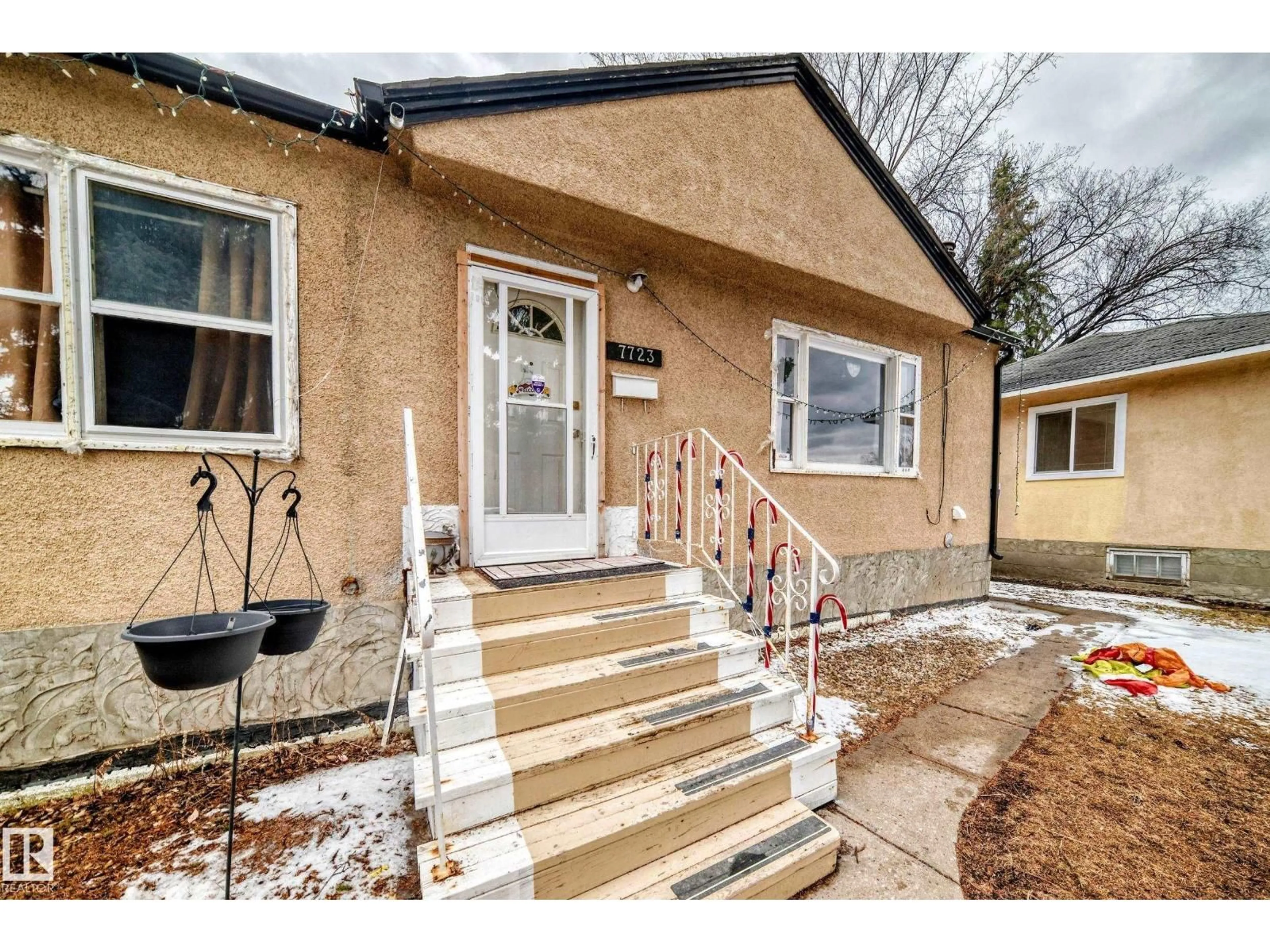 Home with brick exterior material, street for 7723 82 AV, Edmonton Alberta T6C0X8