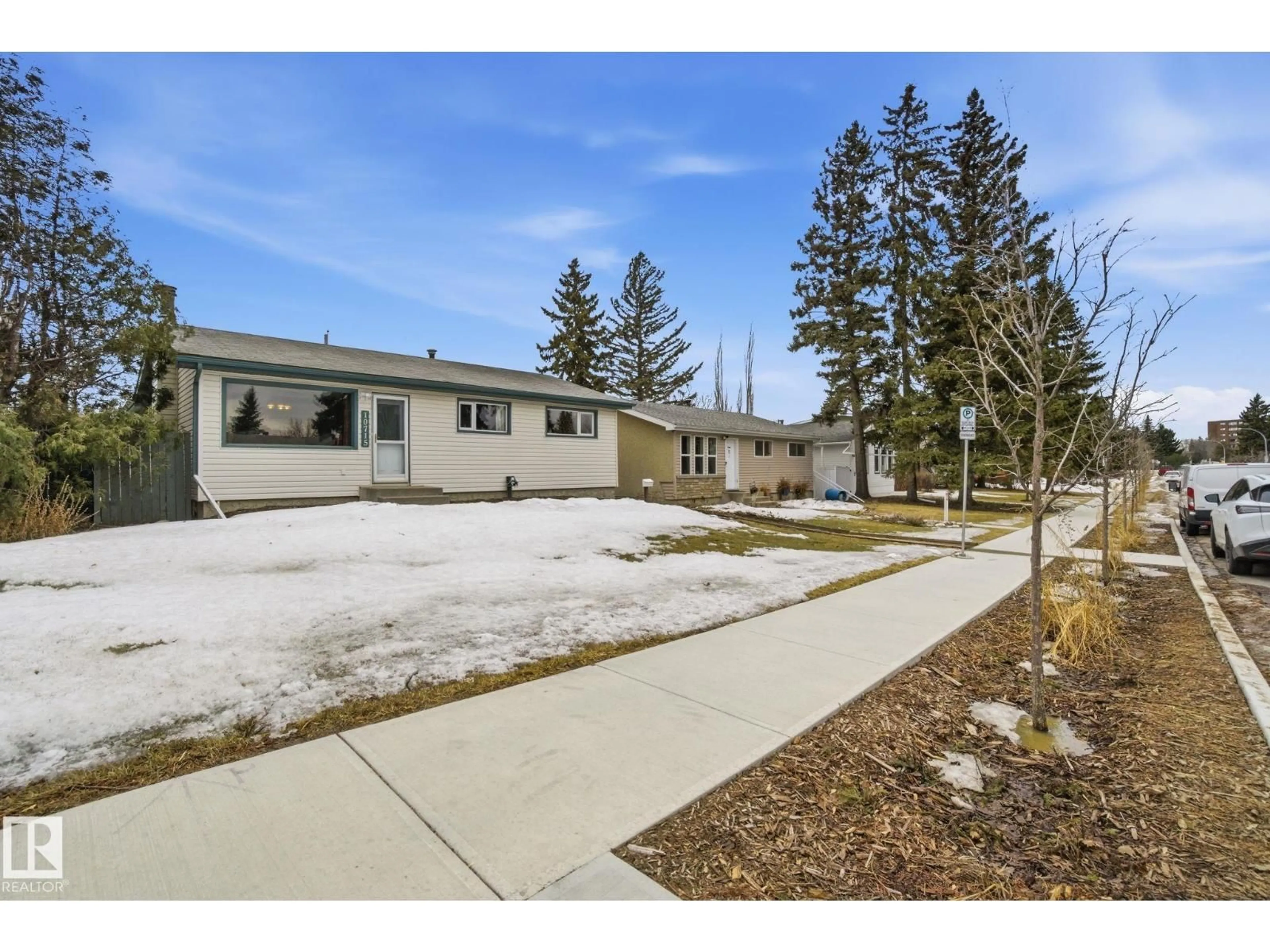 A pic from outside/outdoor area/front of a property/back of a property/a pic from drone, street for 10715 52 AV, Edmonton Alberta T6H0P2