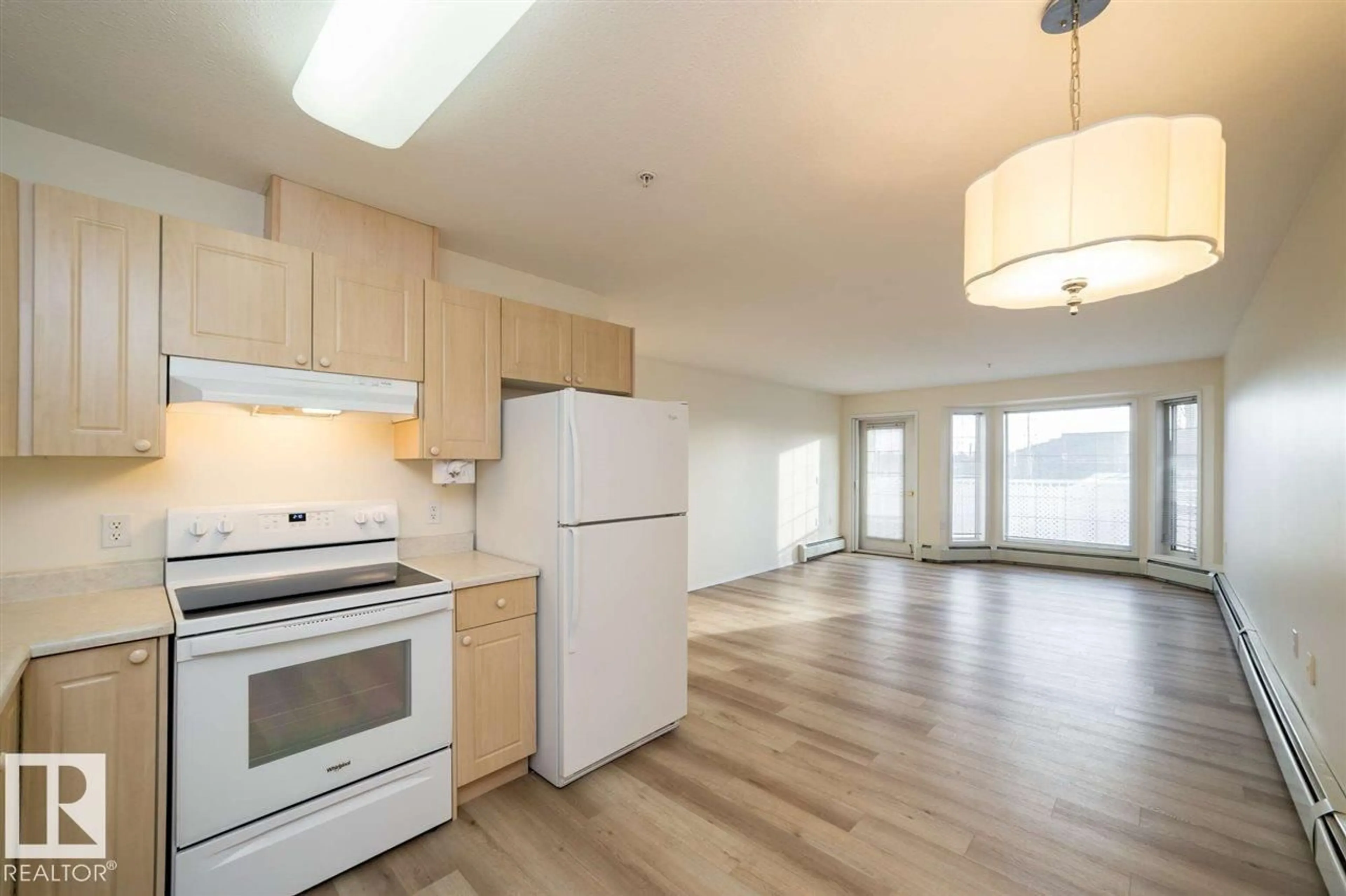 Open concept kitchen, wood/laminate floor for 252 13441 127 ST NW, Edmonton Alberta T5L5B6