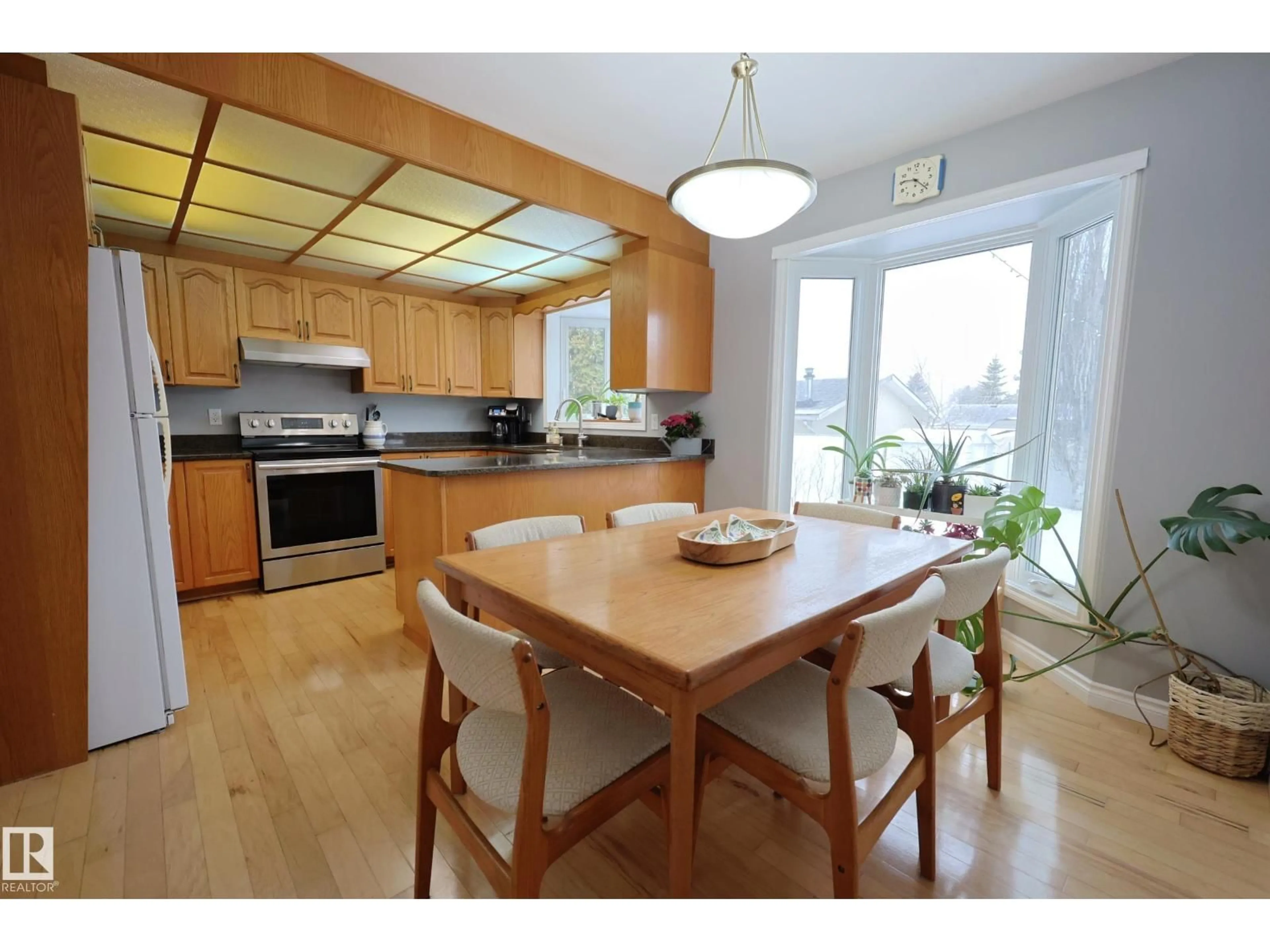 Open concept kitchen, wood/laminate floor for 43 BRAMPTON ST, Spruce Grove Alberta T7X1E8