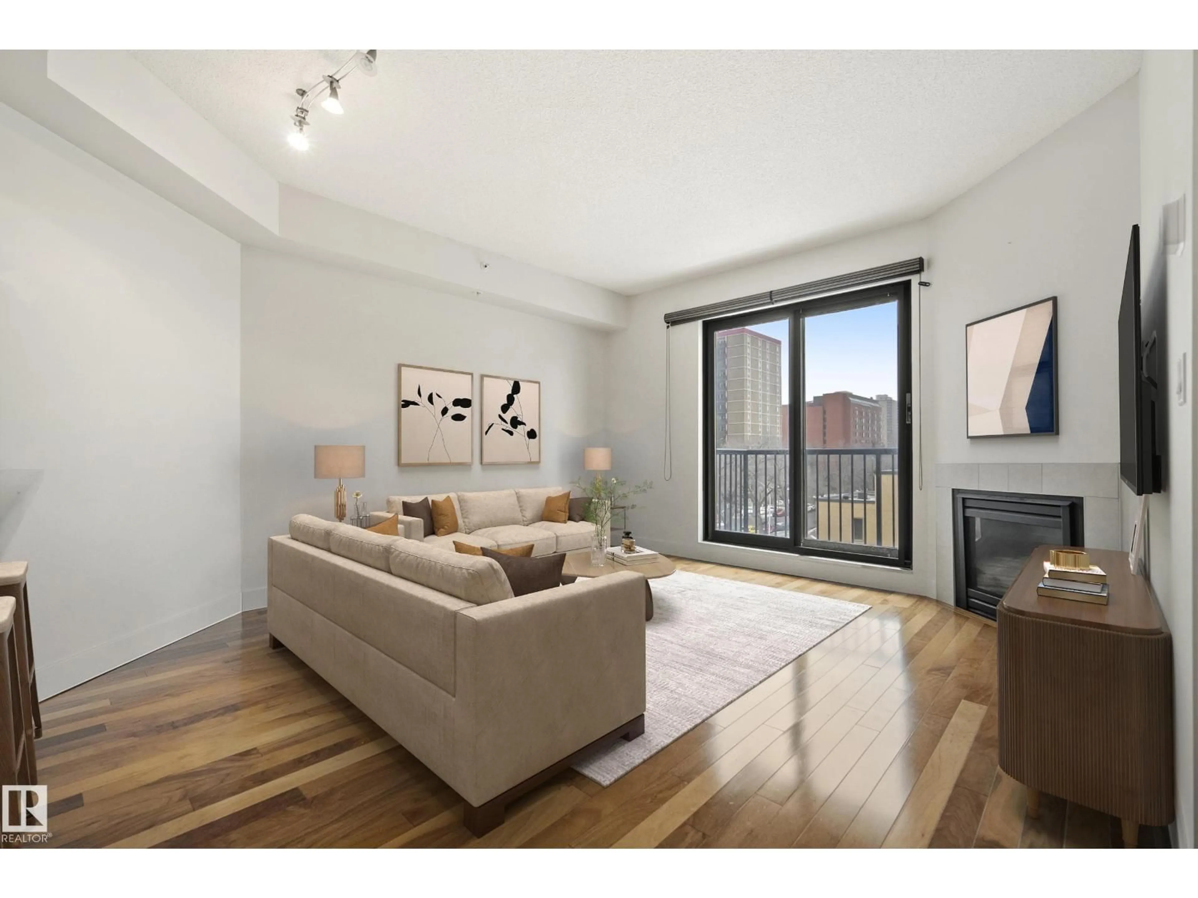 Living room with furniture, wood/laminate floor for #401 - 11933 JASPER AV, Edmonton Alberta T5K0P1