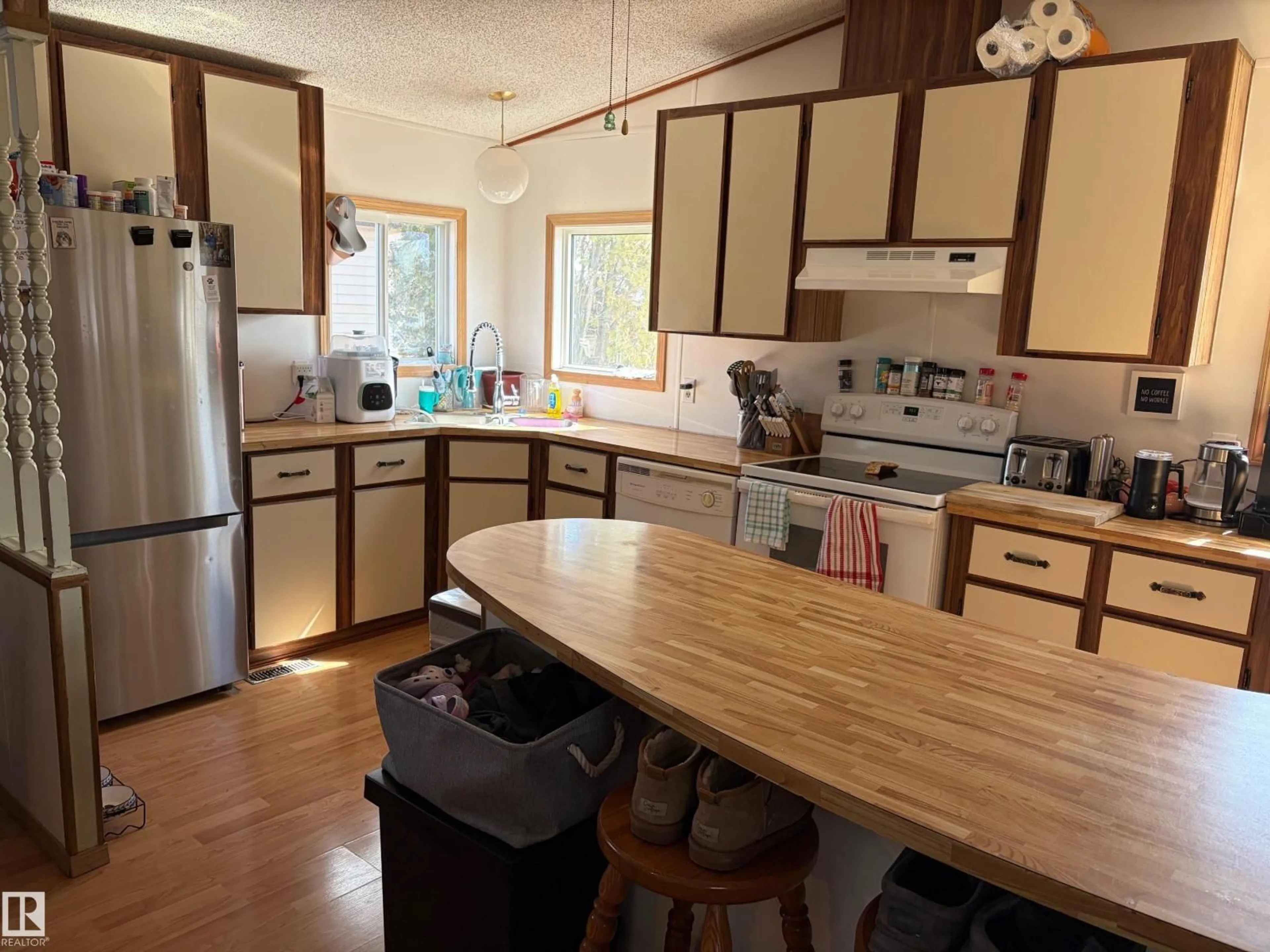 Open concept kitchen, wood/laminate floor for 32 - 4202 45 ST, Wetaskiwin Alberta T9A2L3