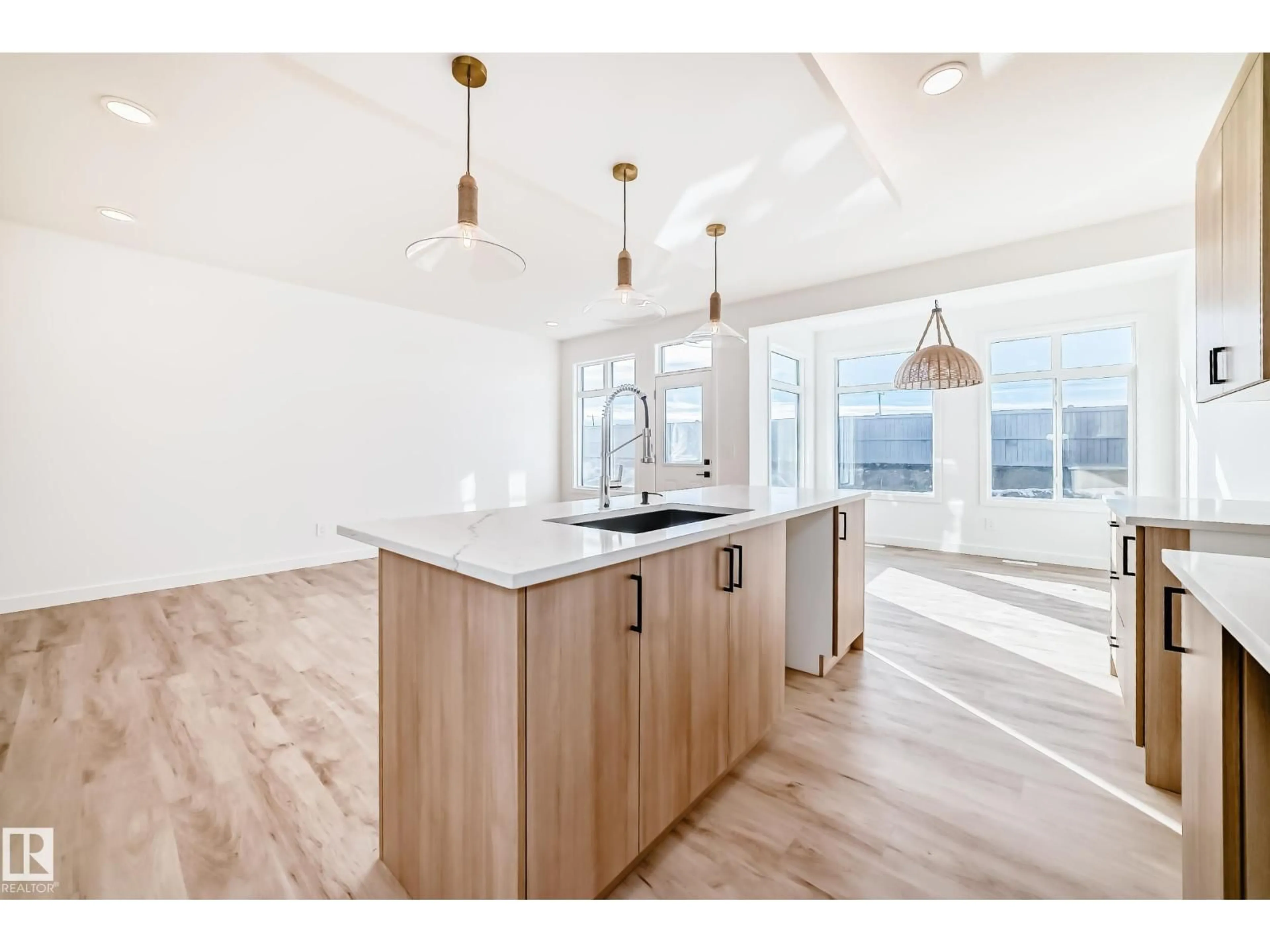 Open concept kitchen, wood/laminate floor for NW - 4132 208 ST, Edmonton Alberta T6W5S2