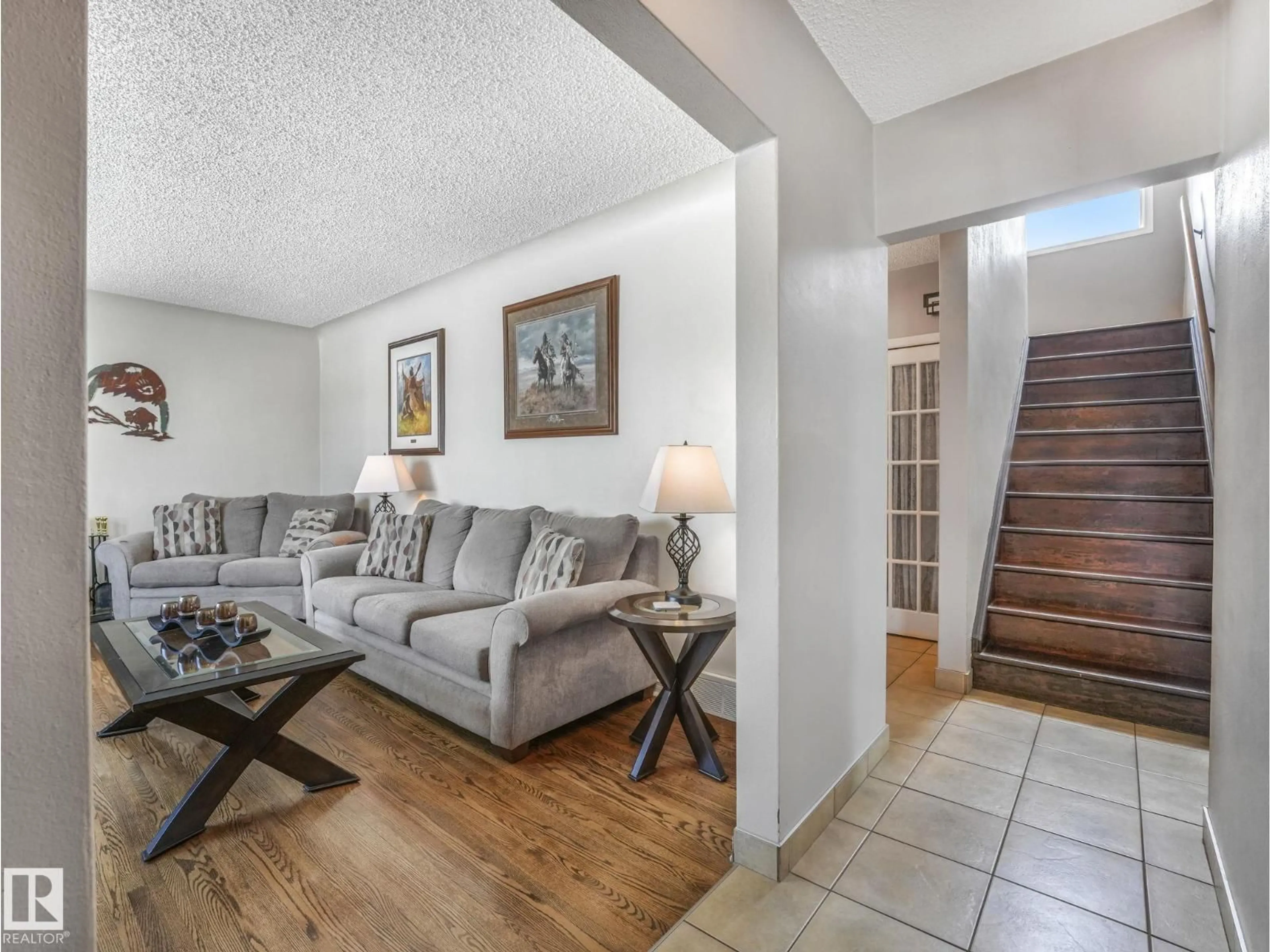 Living room with furniture, unknown for 7653 91 AV, Edmonton Alberta T6C1P7