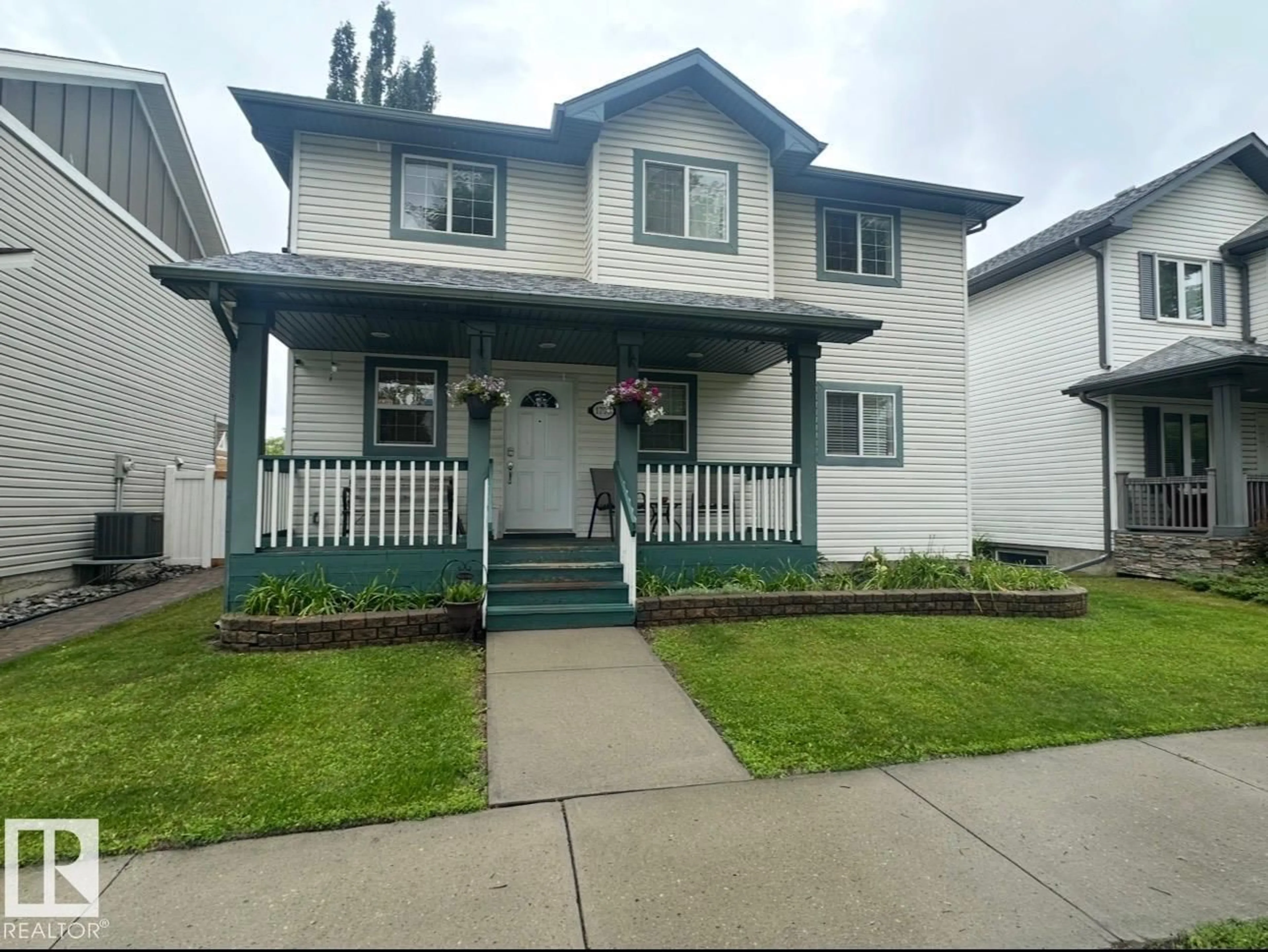 Home with vinyl exterior material, street for NW - 1750 TOMLINSON CM, Edmonton Alberta T6R2W5