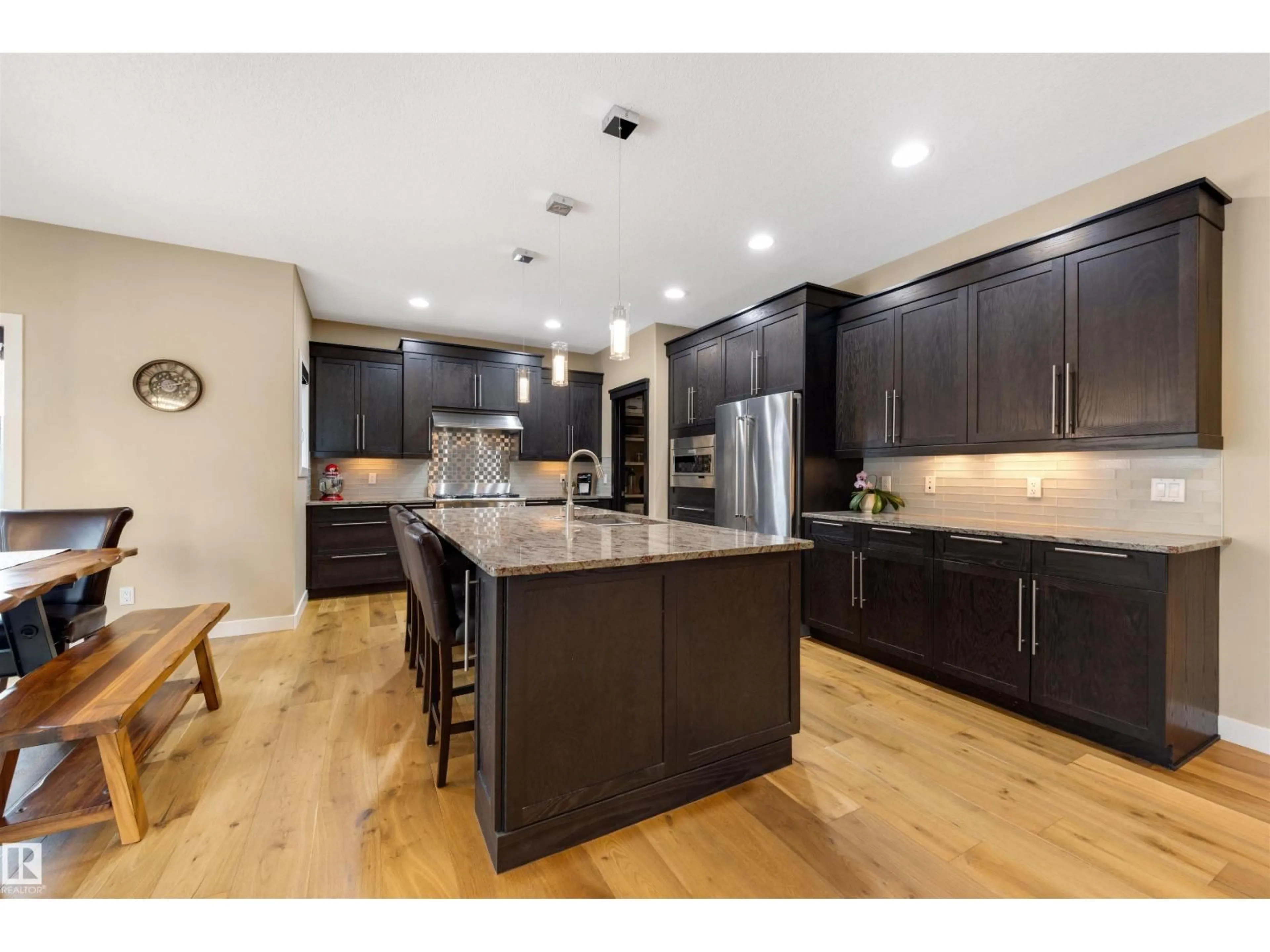 Open concept kitchen, wood/laminate floor for 6011 MAYNARD WY, Edmonton Alberta T6R0P7
