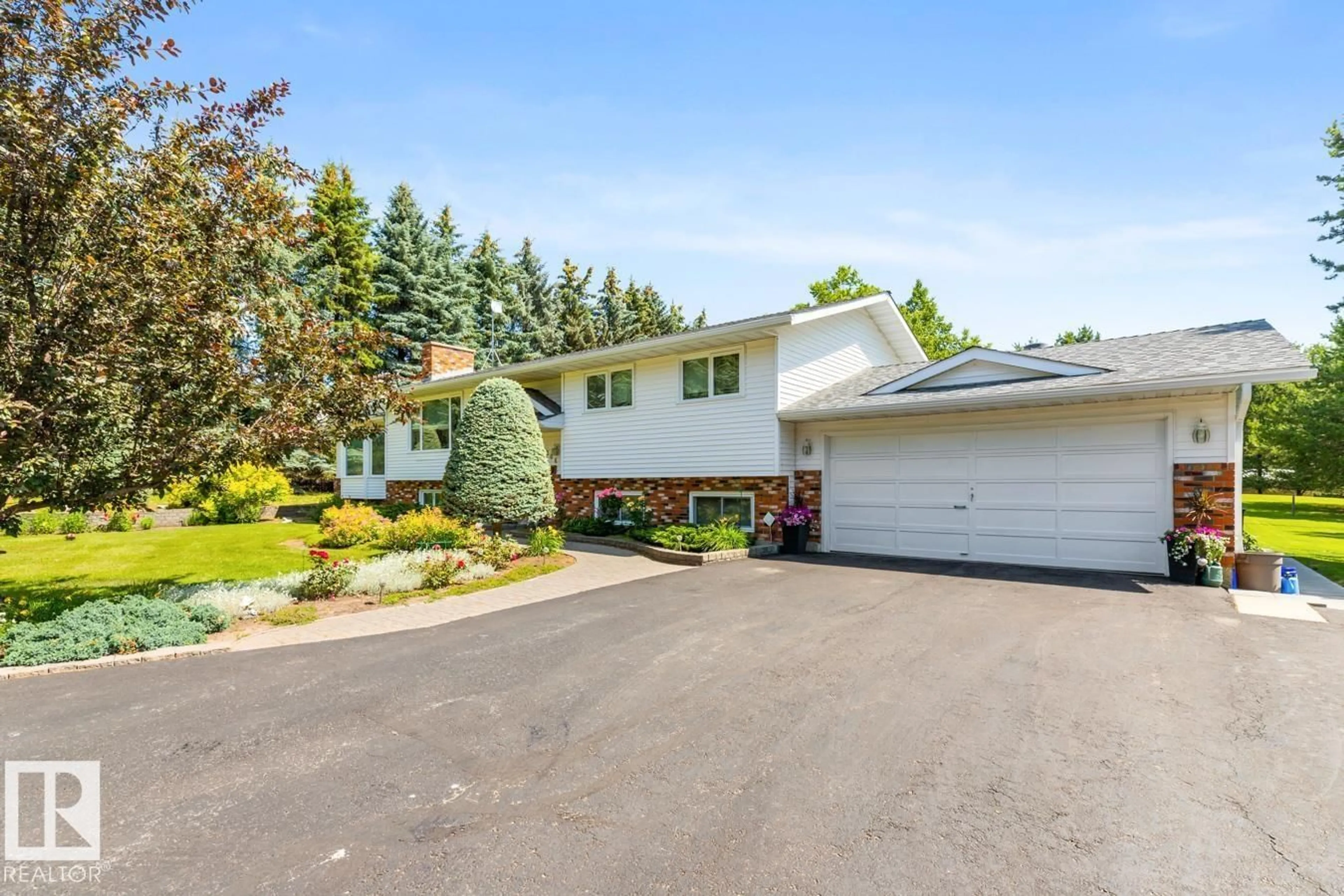 Home with vinyl exterior material, street for 52150 - 206 RGE ROAD 221 RGE ROAD, Rural Strathcona County Alberta T8E1C8