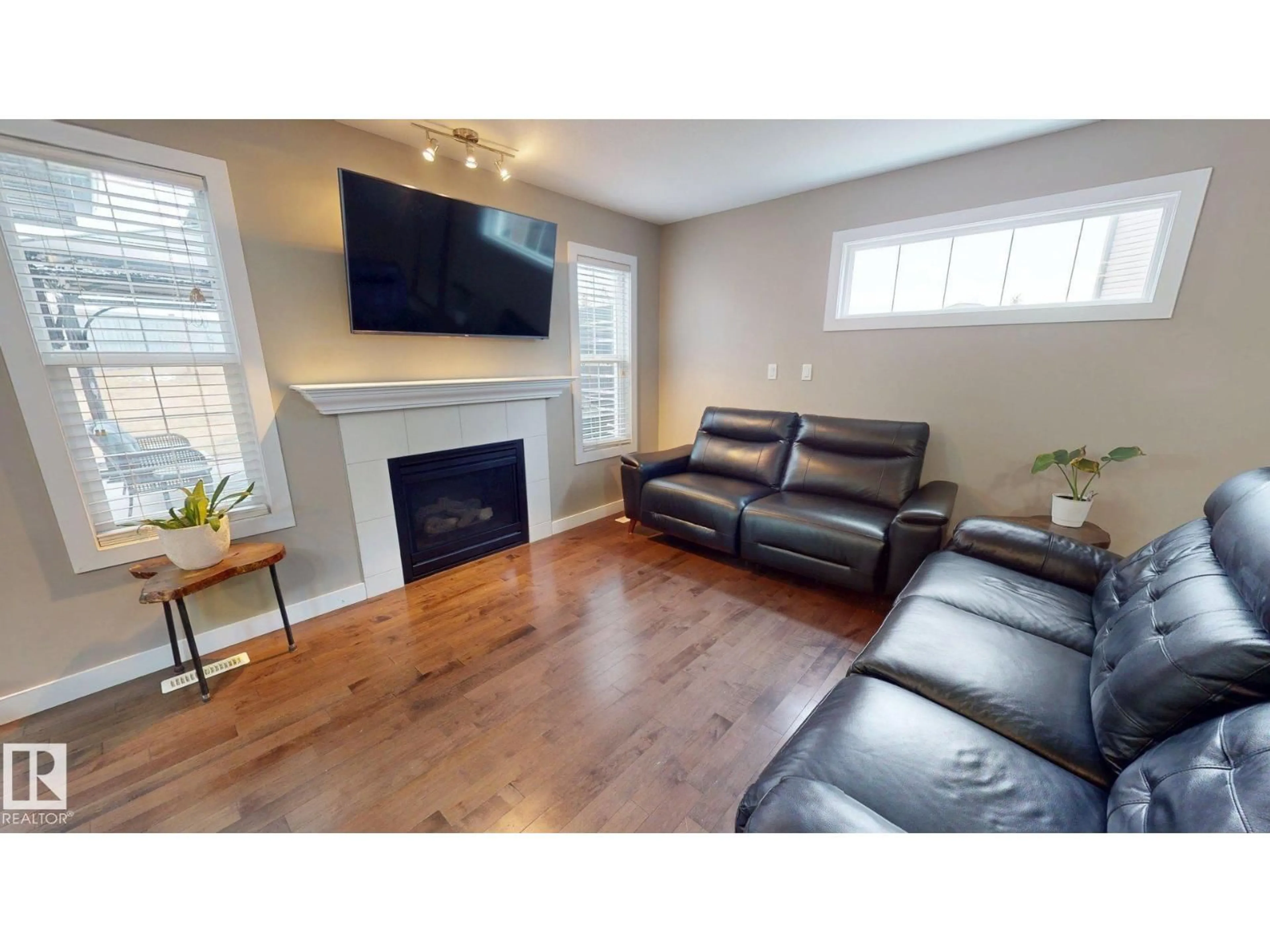 Living room with furniture, wood/laminate floor for NW - 3885 GALLINGER LO, Edmonton Alberta T5T4G6