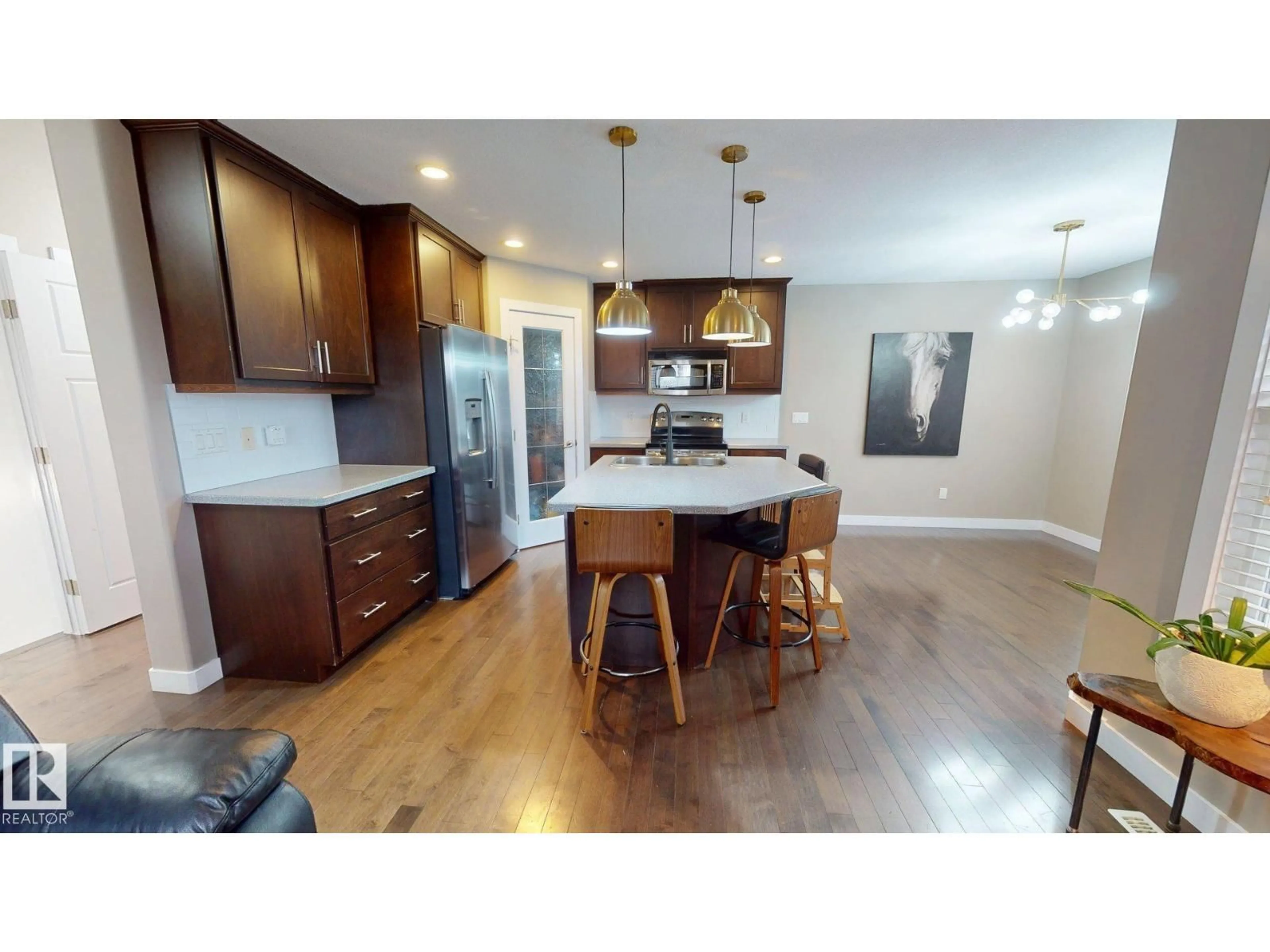 Open concept kitchen, wood/laminate floor for NW - 3885 GALLINGER LO, Edmonton Alberta T5T4G6