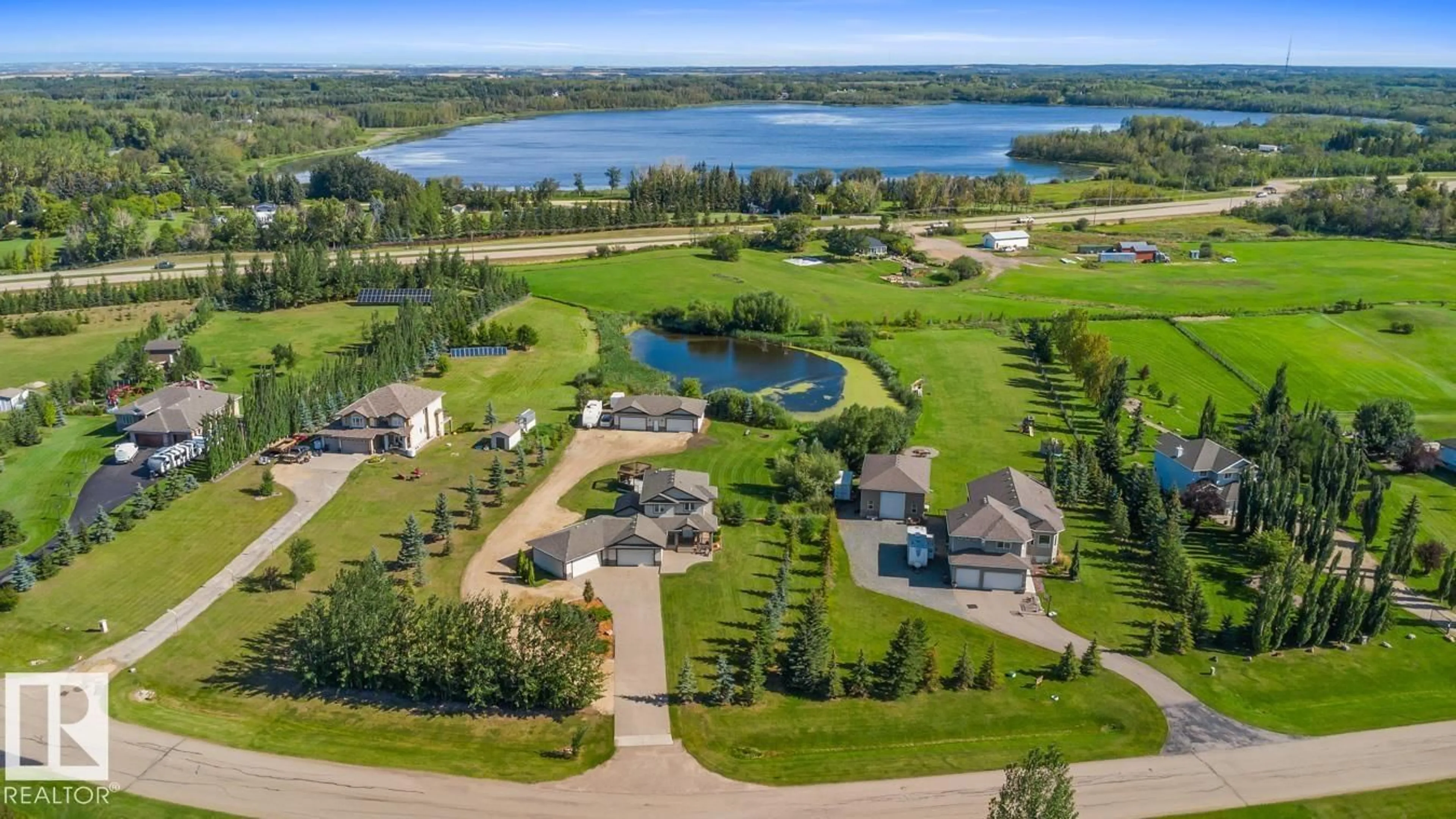A pic from outside/outdoor area/front of a property/back of a property/a pic from drone, water/lake/river/ocean view for 52358 - 374 RGE ROAD 225, Rural Strathcona County Alberta T8C1J7