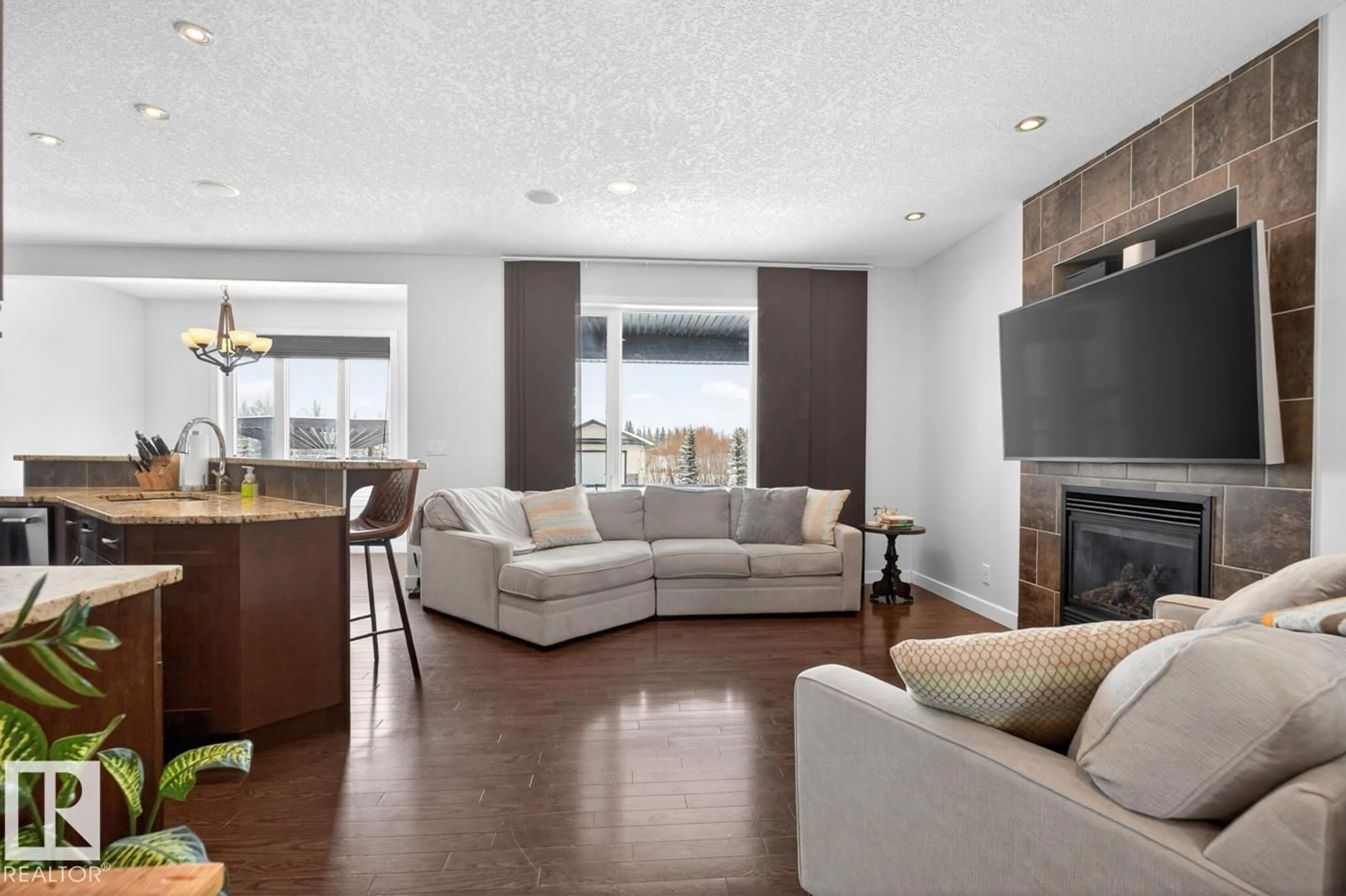 Living room with furniture, wood/laminate floor for 52358 - 374 RGE ROAD 225, Rural Strathcona County Alberta T8C1J7