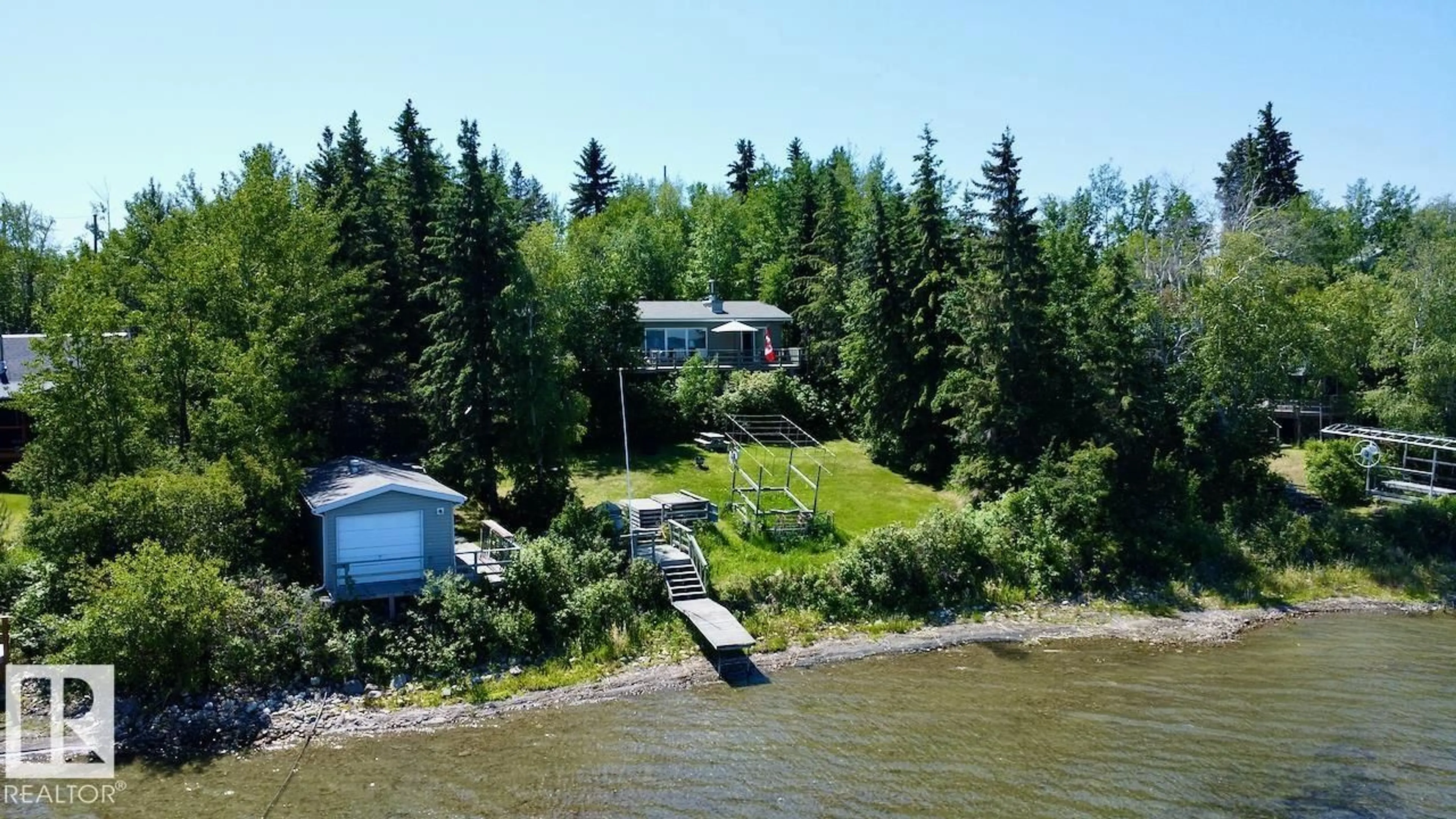 A pic from outside/outdoor area/front of a property/back of a property/a pic from drone, water/lake/river/ocean view for 52515 - 19A RGE RD 52, Rural Parkland County Alberta T0E2B0
