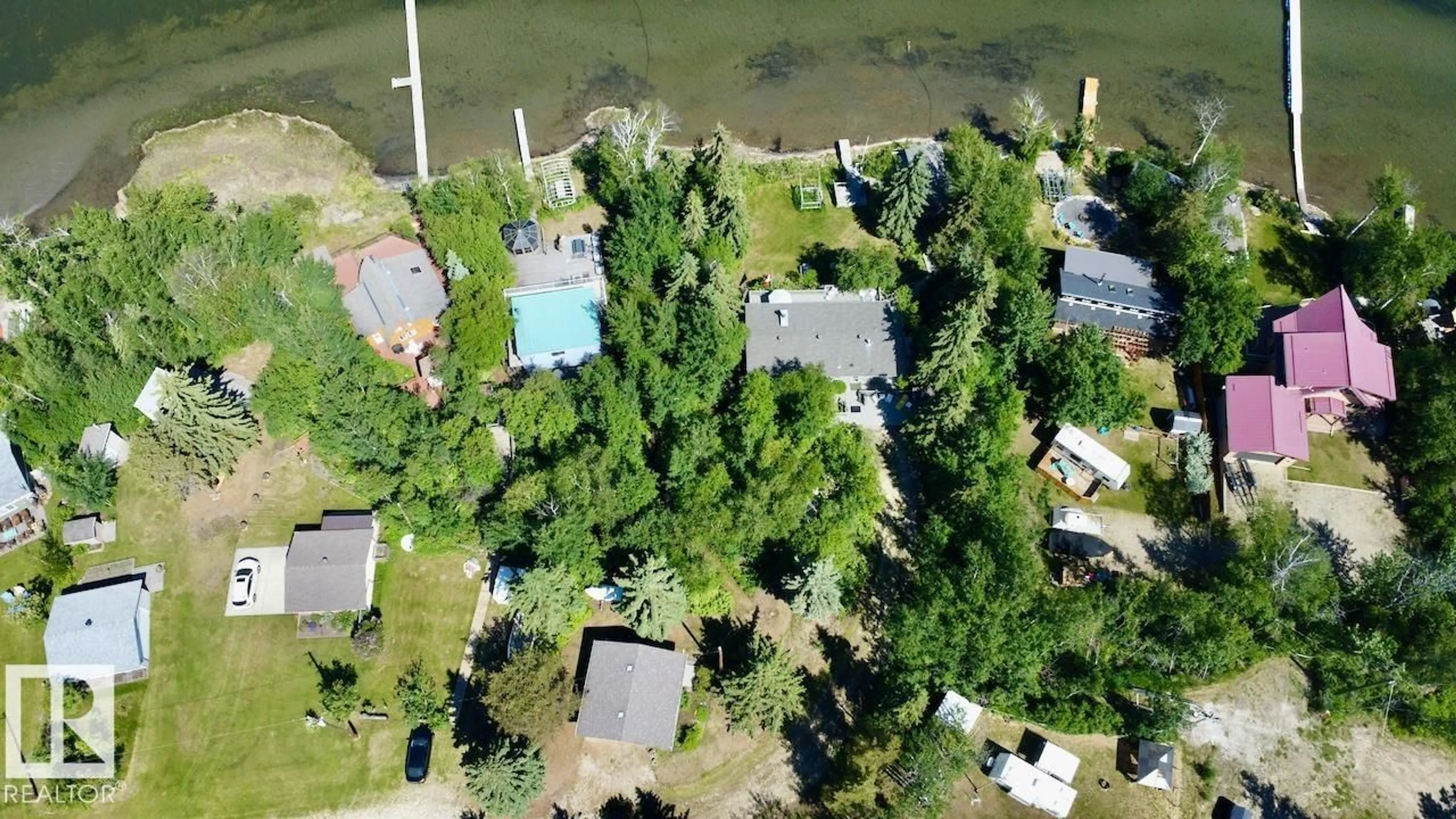 A pic from outside/outdoor area/front of a property/back of a property/a pic from drone, water/lake/river/ocean view for 52515 - 19A RGE RD 52, Rural Parkland County Alberta T0E2B0
