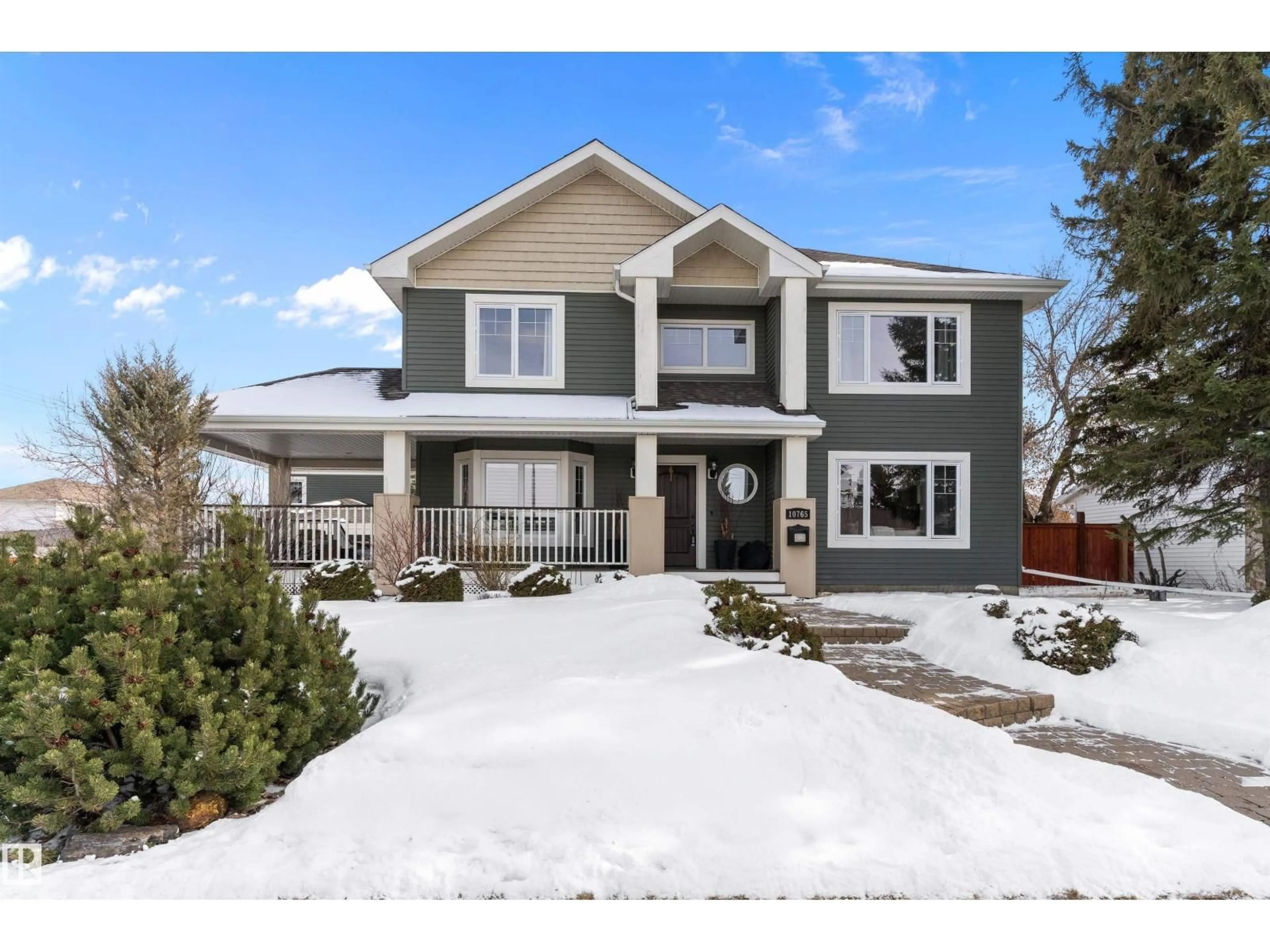 Home with vinyl exterior material, street for NW - 10765 65 ST, Edmonton Alberta T6A2P3