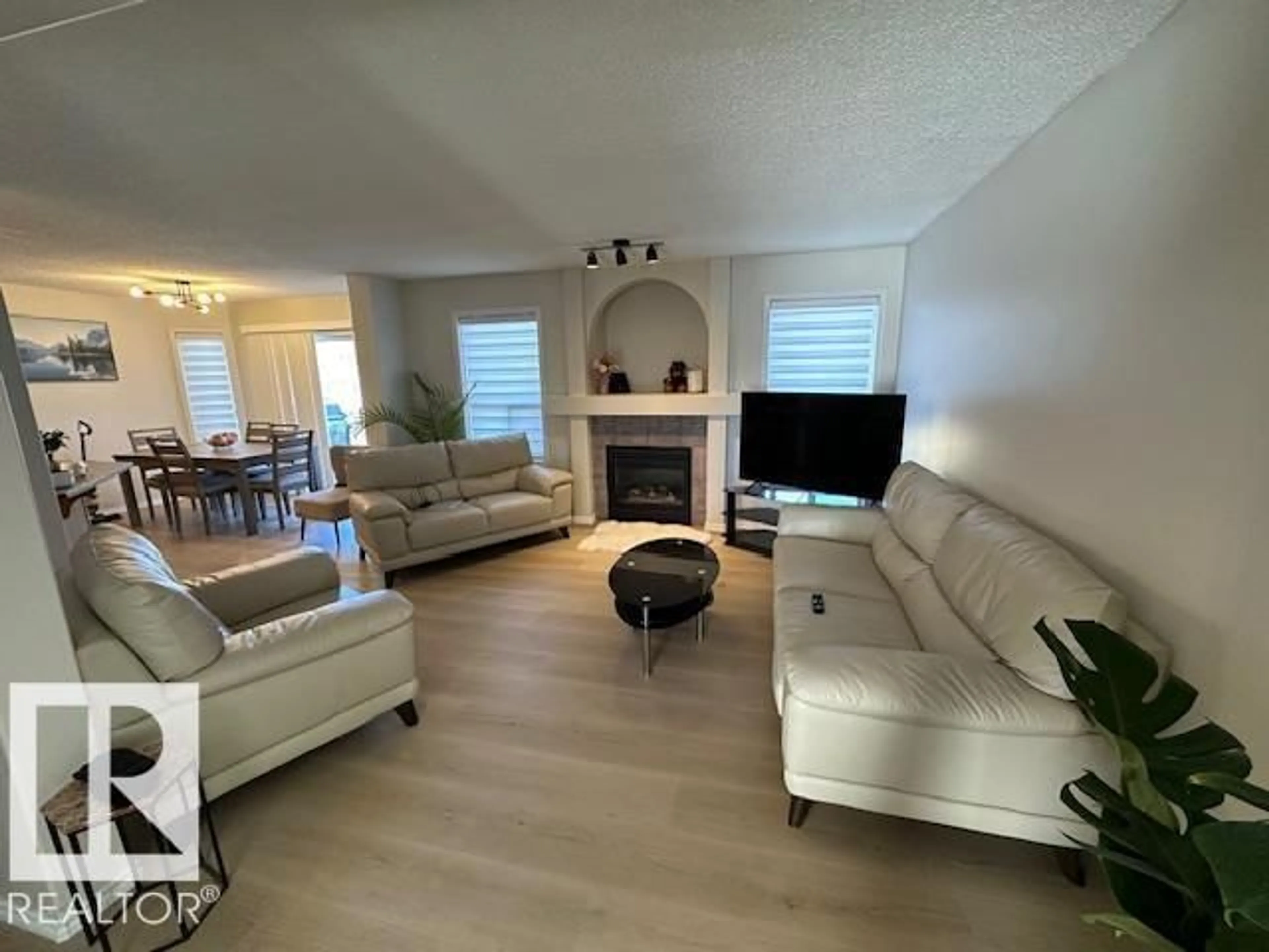 Living room with furniture, wood/laminate floor for 9806 179 AV, Edmonton Alberta T5X6A6