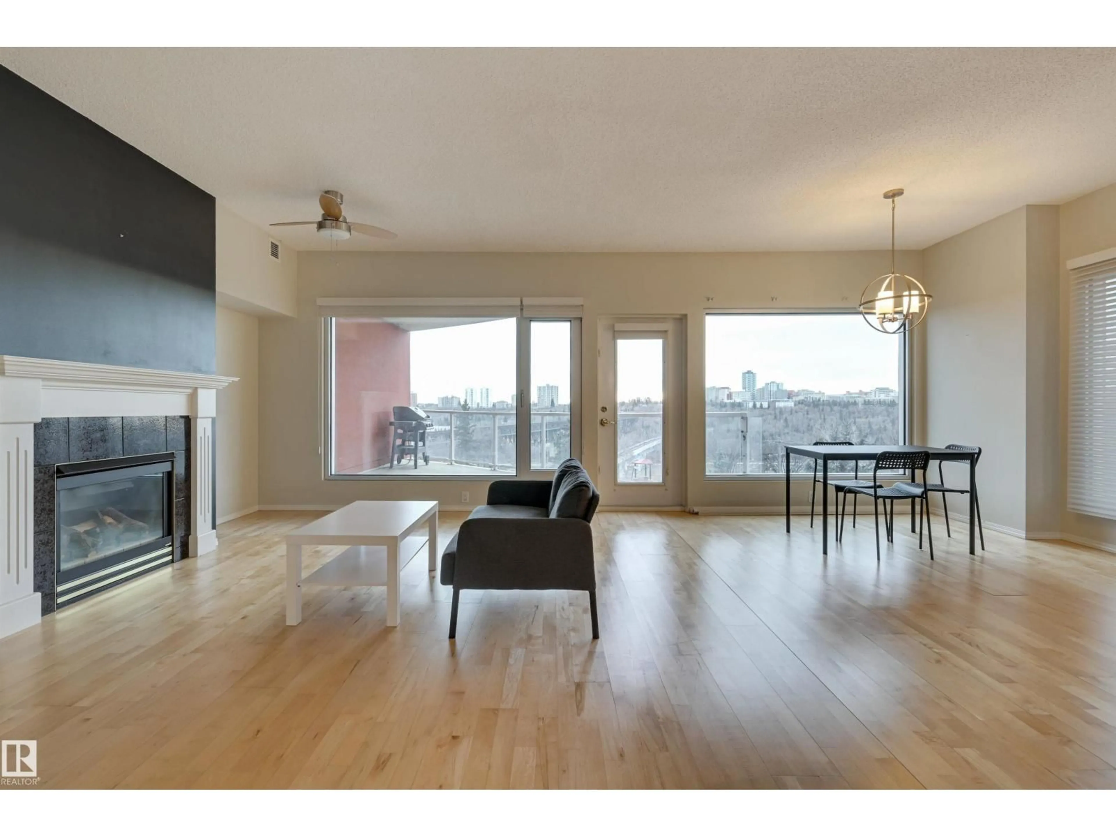 Living room with furniture, wood/laminate floor for 501 - 9708 110 ST NW, Edmonton Alberta T5K2W3