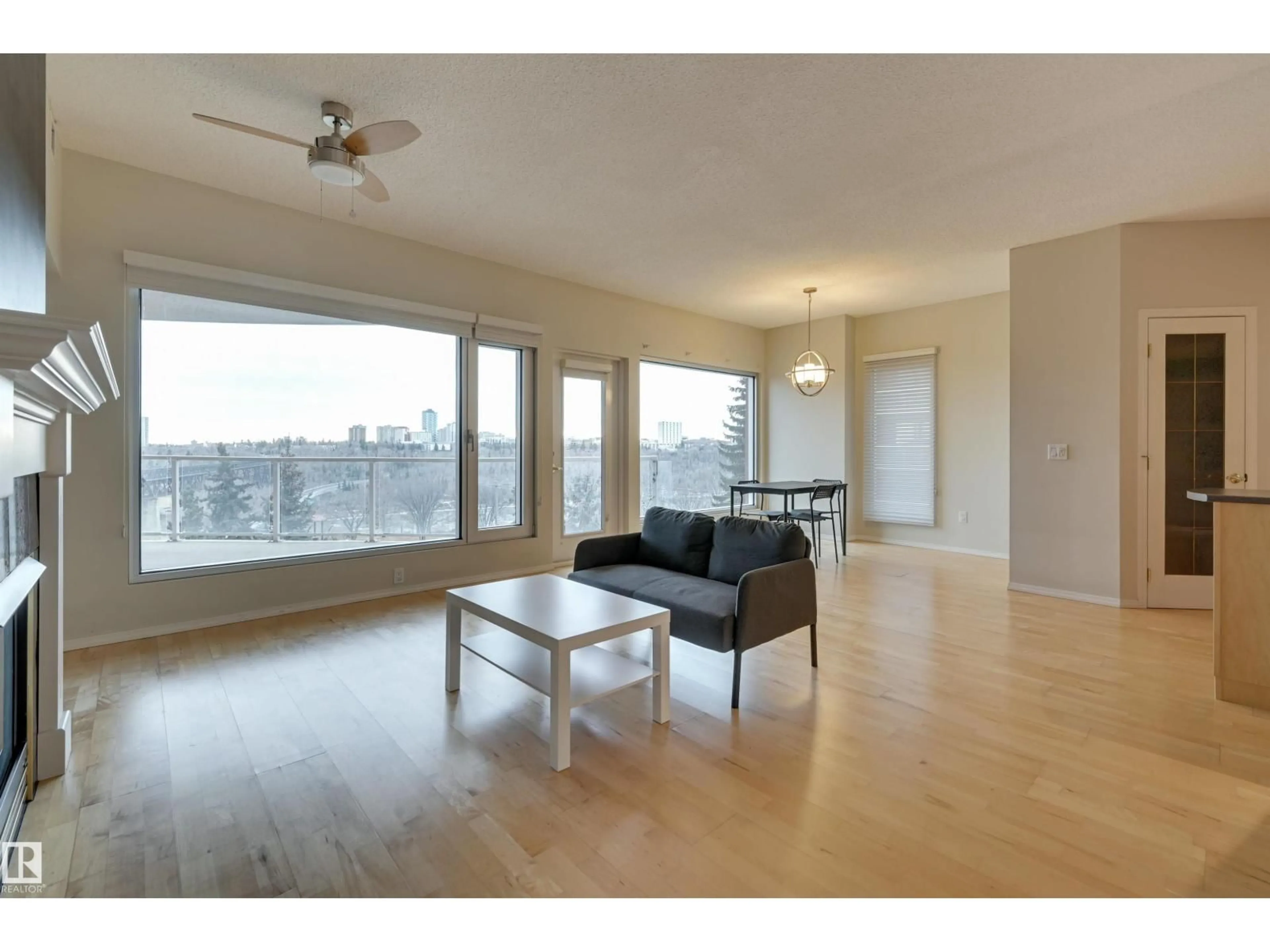 Living room with furniture, wood/laminate floor for 501 - 9708 110 ST NW, Edmonton Alberta T5K2W3