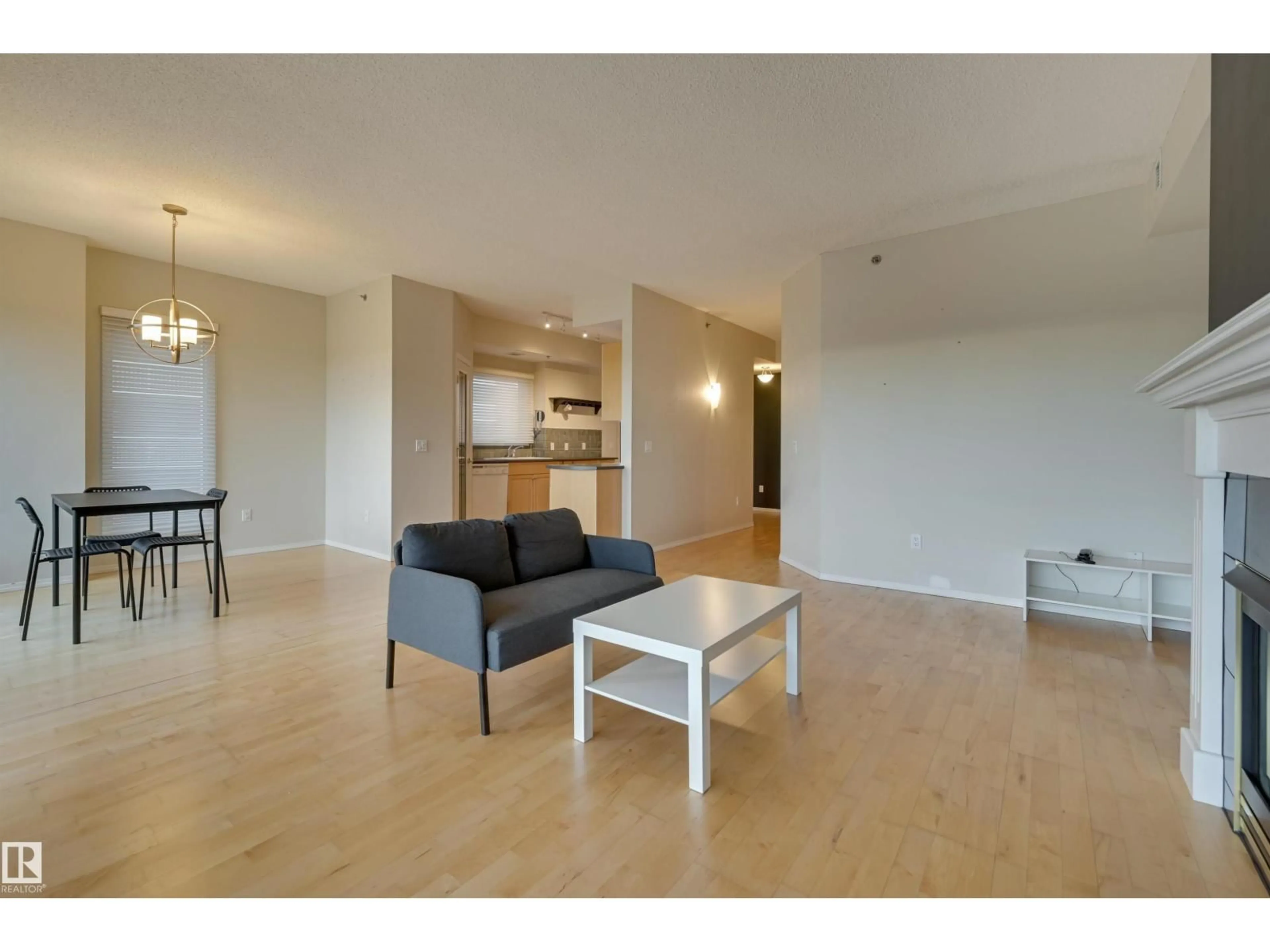 Living room with furniture, wood/laminate floor for 501 - 9708 110 ST NW, Edmonton Alberta T5K2W3