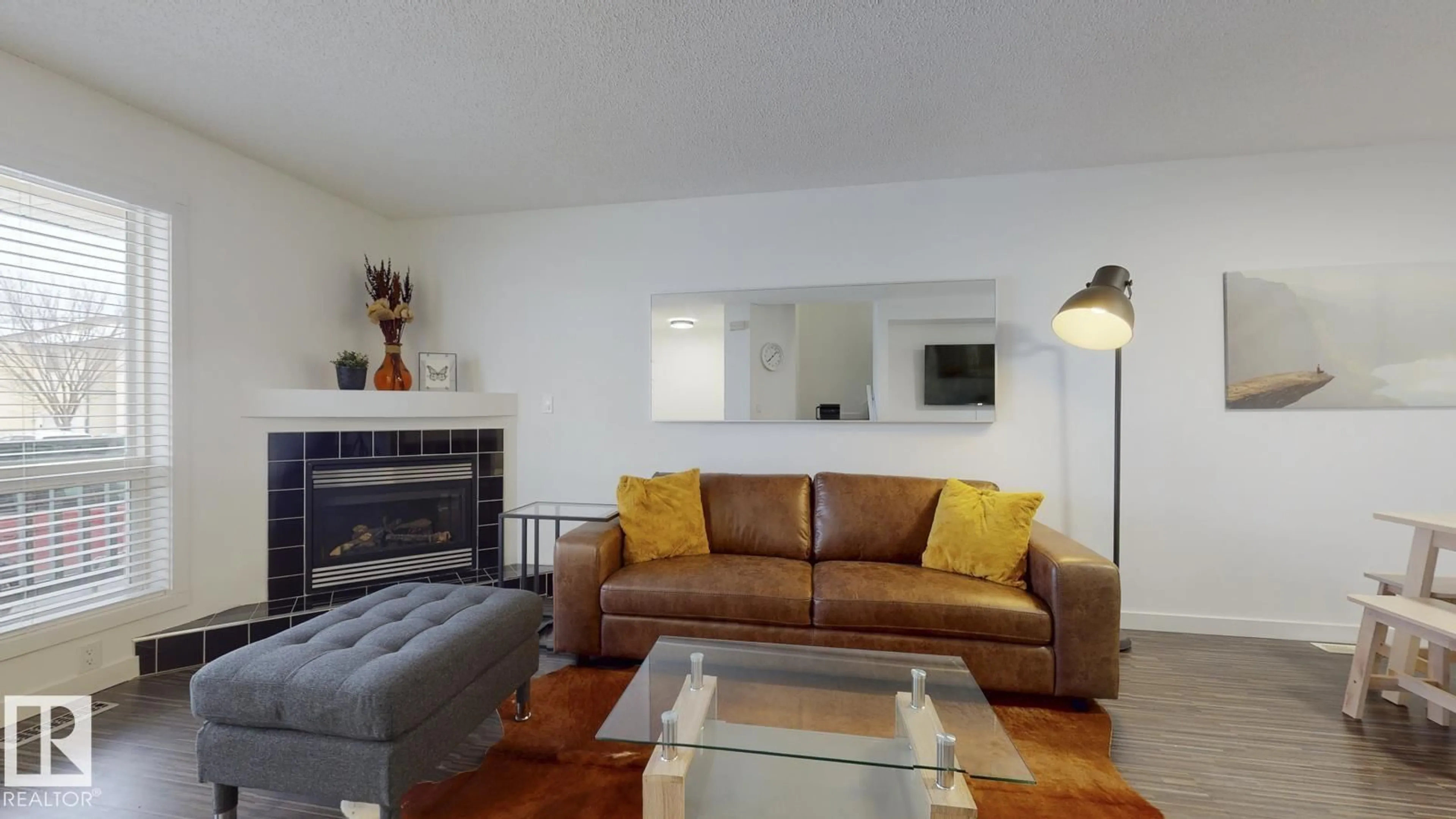 Living room with furniture, wood/laminate floor for 52 - 10909 106 ST NW, Edmonton Alberta T5H4M7