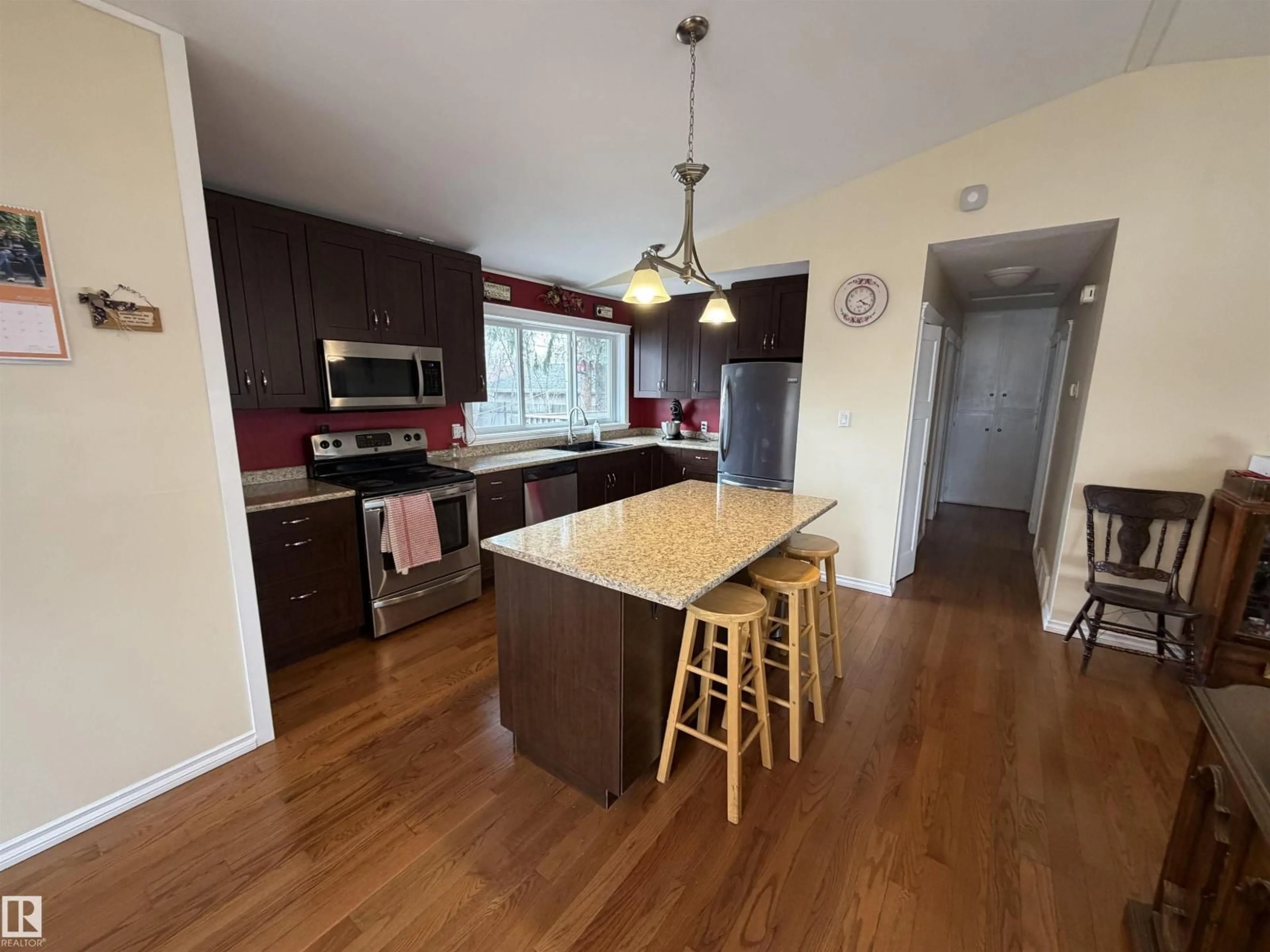 Open concept kitchen, wood/laminate floor for 15926 92 AV, Edmonton Alberta T5R5C6