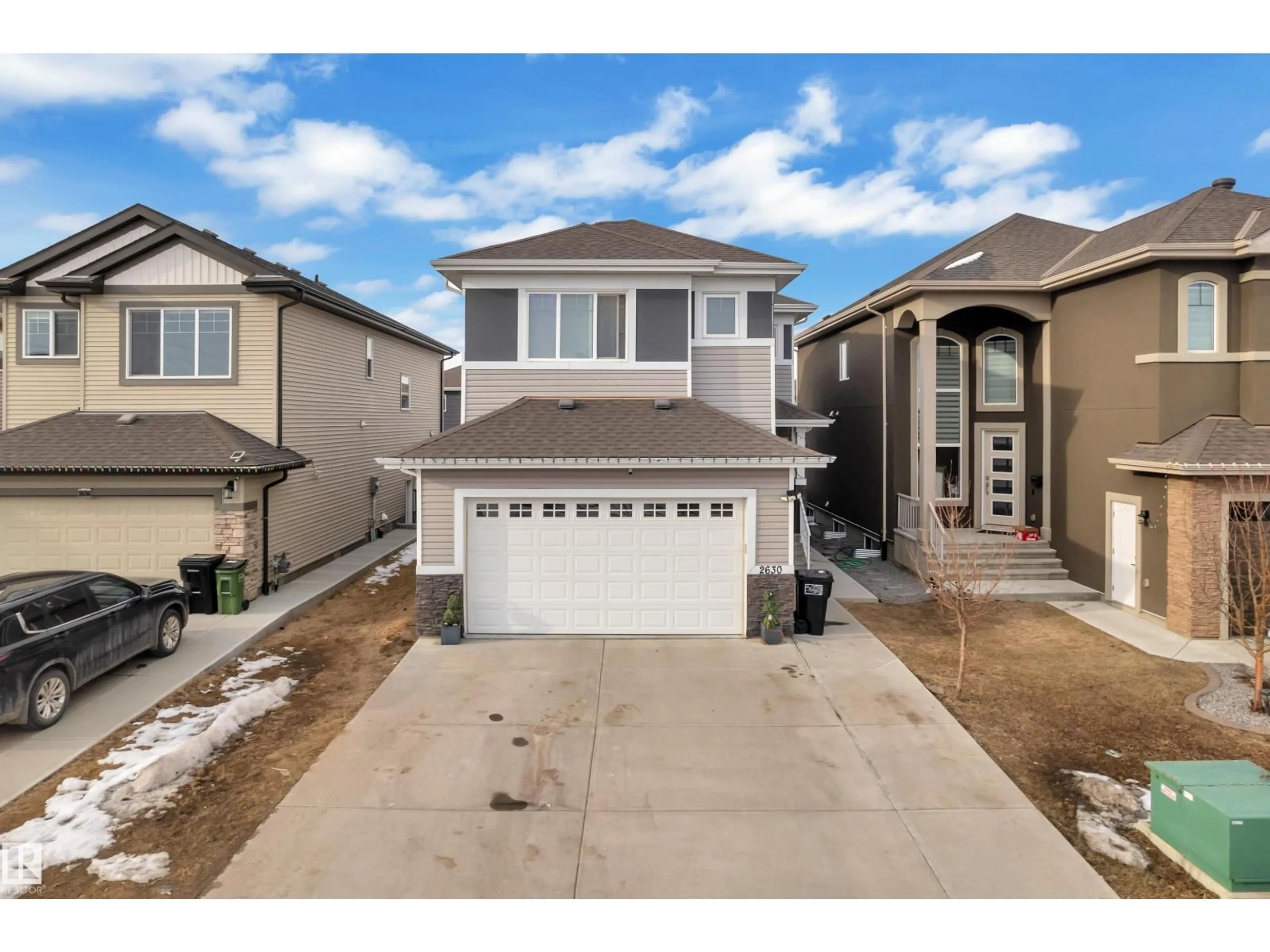 Home with vinyl exterior material, street for 2630 16A AVE NW, Edmonton Alberta T6T2H6