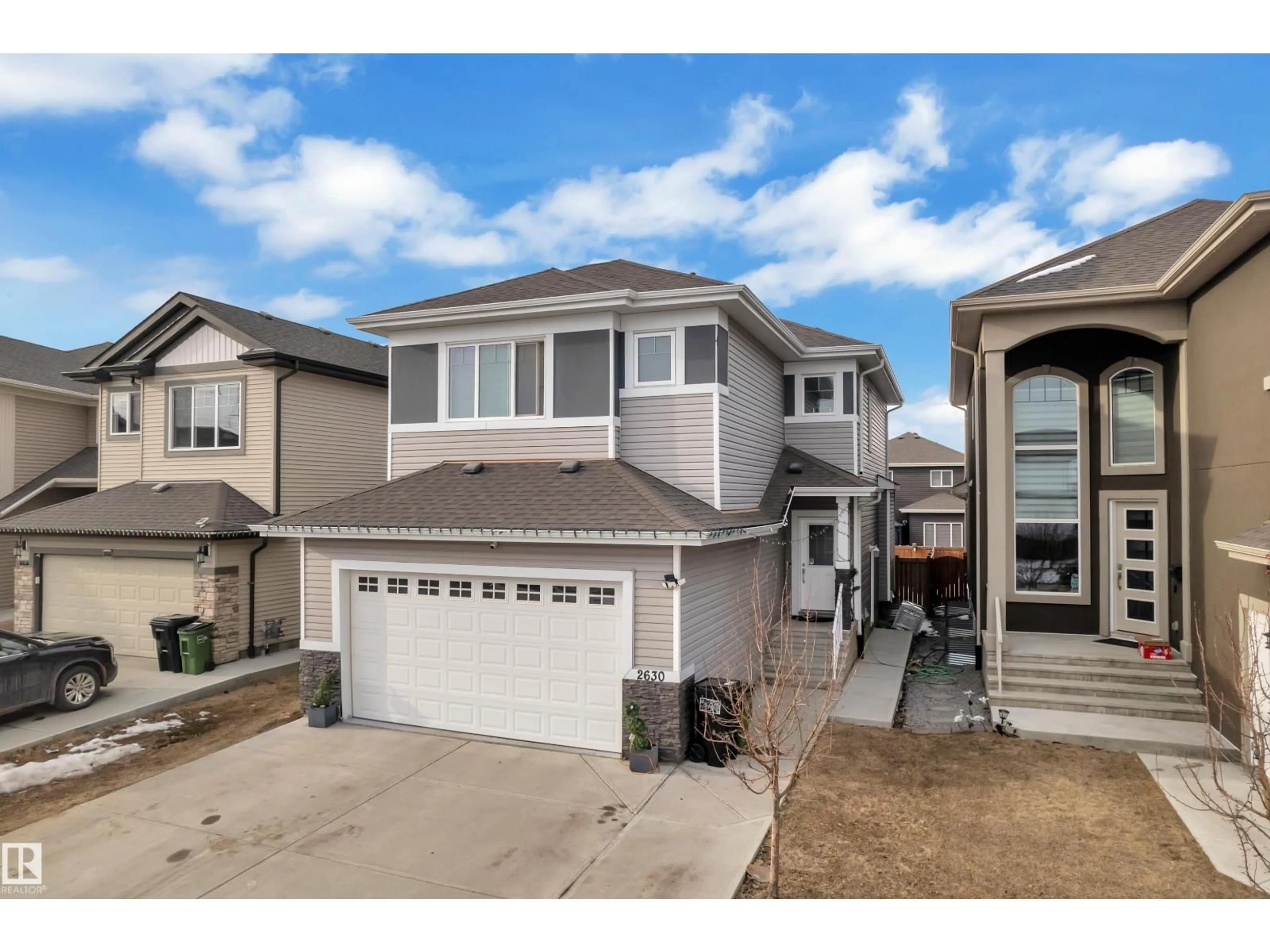 Home with vinyl exterior material, street for 2630 16A AVE NW, Edmonton Alberta T6T2H6