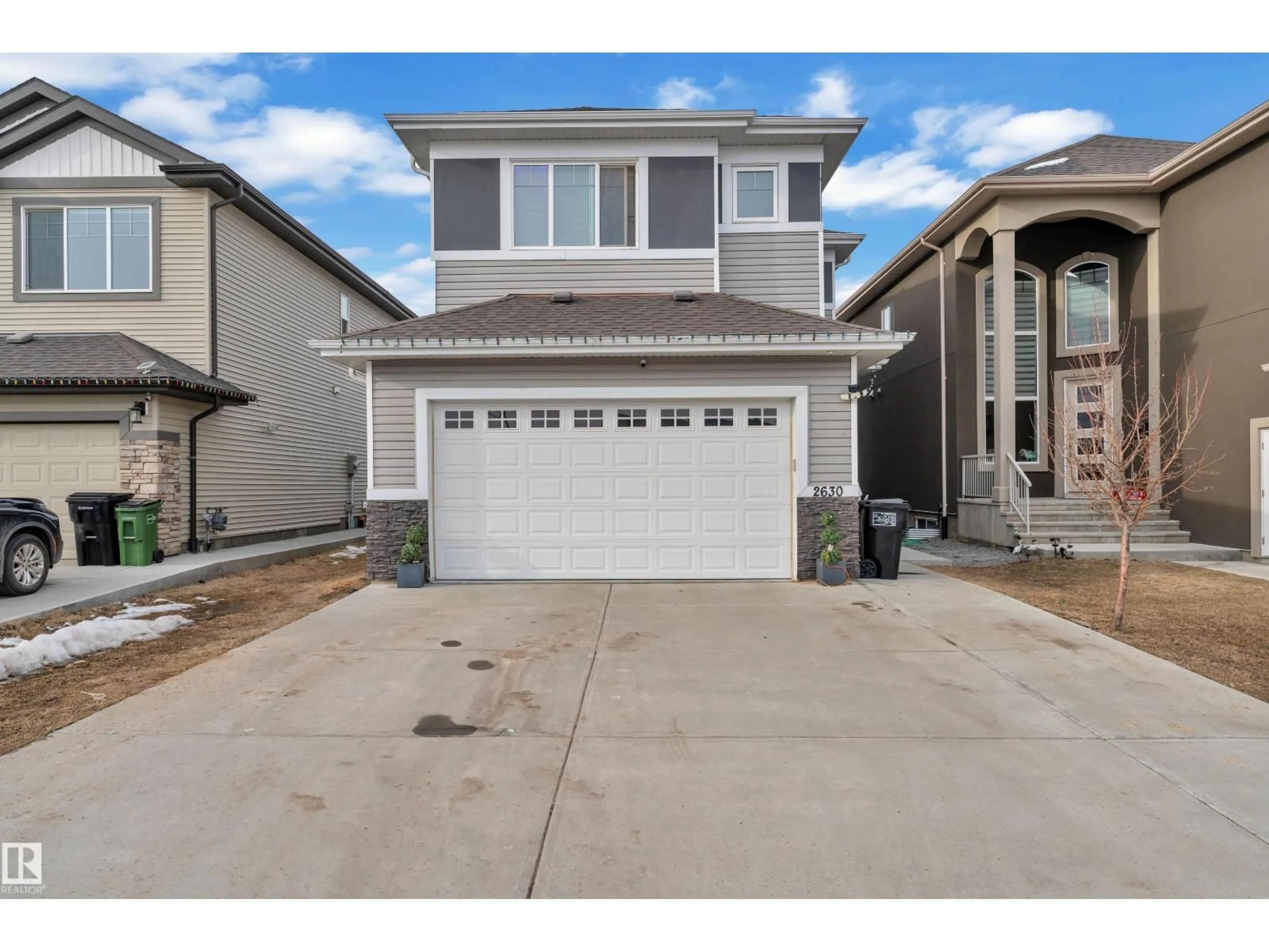 Home with vinyl exterior material, street for 2630 16A AVE NW, Edmonton Alberta T6T2H6